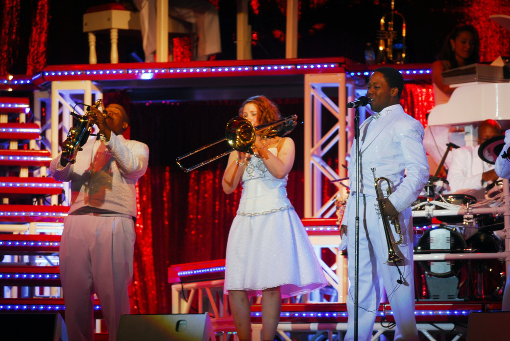 Airman 1st Class Anthony Williams does his best Louis Armstrong impersonation as part of the Air Force's Expeditionary Entertainers, Tops In Blue, performance at the Presidio of Monterey, June 11. (Department of Defense Photos by Petty Officer 2nd Class Steven L. Shepard.)
