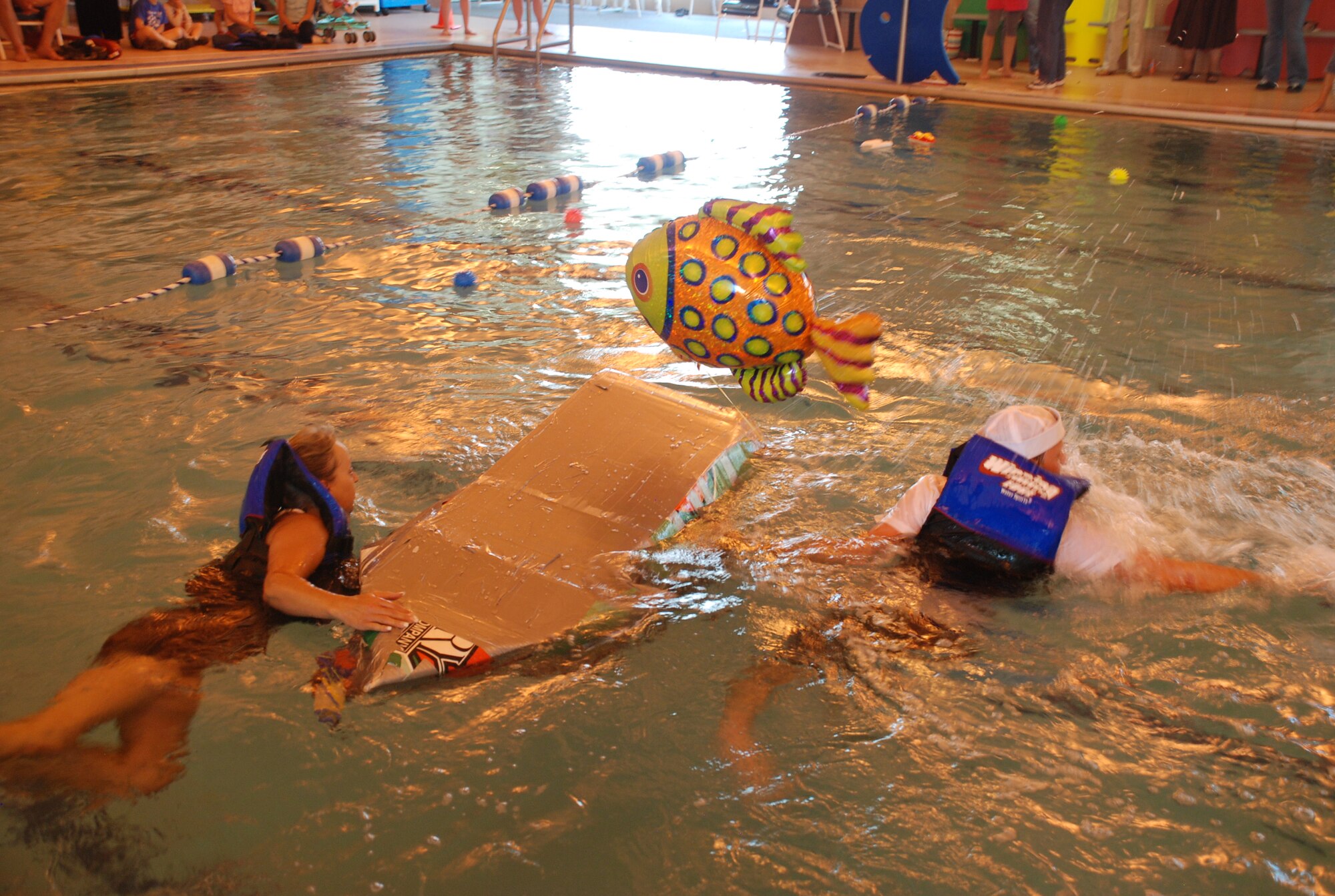 The 90th Force Support Squadron’s Seagrams won the fastest sinking award for staying afloat only two seconds. Jeff Waddell and Kim Zakar swim the boat across the pool to complete the competition.