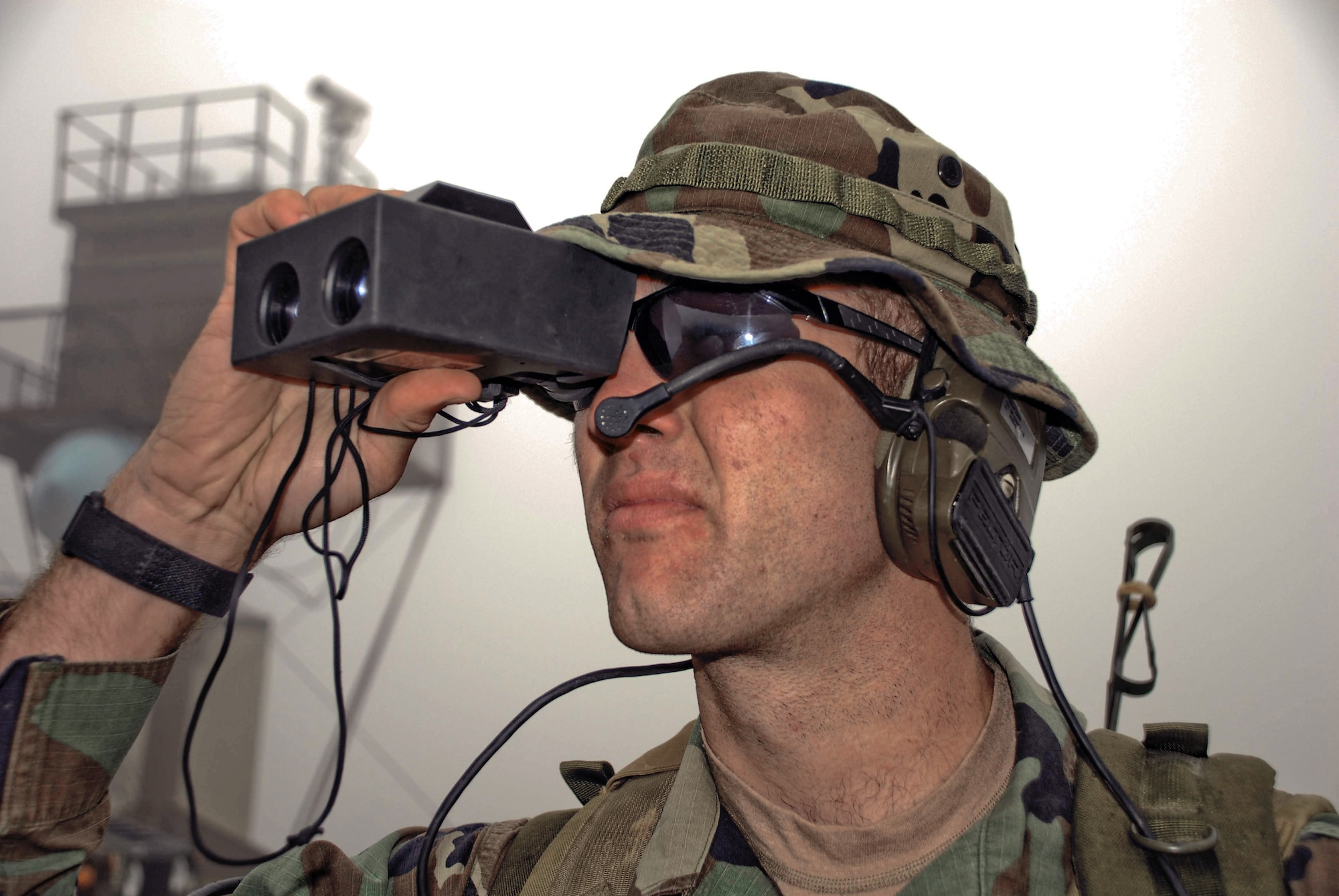 An Air Force combat controller uses a laser range finder, which helps him direct pilots to their correct targets. During this training mission June 23, several combat controllers called in airstrikes on Fort Wainwright's Range 2205 in Alaska. The training mission was part of Northern Edge 2009, an exercise designed to prepare joint forces to respond to crises in the Asian Pacific region. (U.S. Air Force photo/1st. Lt. John Callahan) 