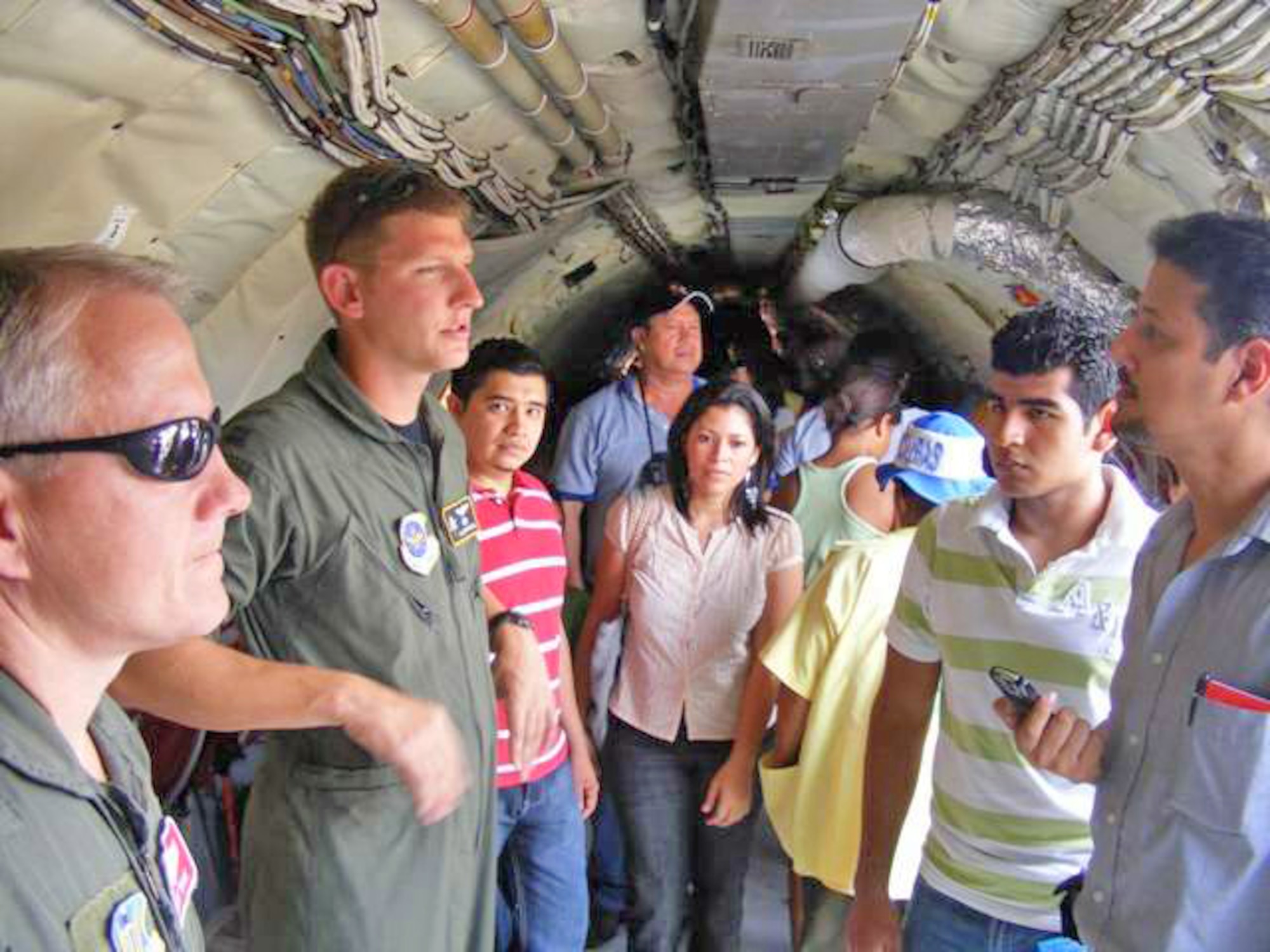 Capt. Isaiah Oppelaar gives a tour of the KC-135 Stratotanker during an air show June 21 at San Pedro Sula, Honduras. More than 30 Airmen participated at the international airshow. Captain Oppelaar is a pilot deployed from MacDill Air Force Base, Fla. (U.S. Air Force photo/Capt. Candace Park) 
