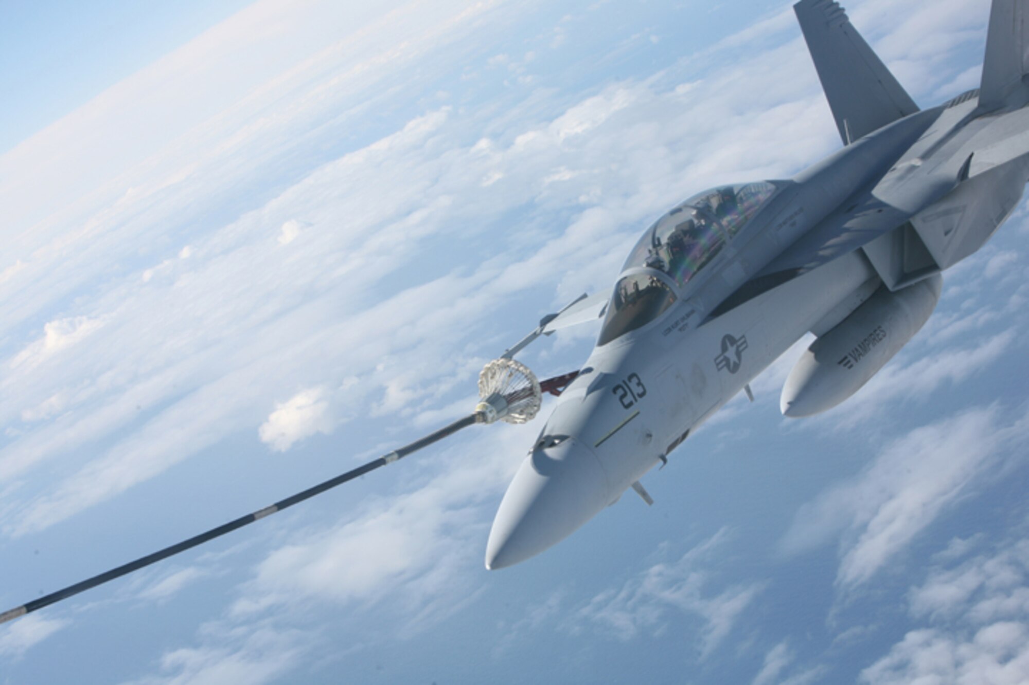 ELMENDORF AIR FORCE BASE, Alaska -- An F/A-18F from Navy Air Test and Evaluation Squadron 9 hooks up to the drogue and hose trailing behind a KC-130J flown by Marine Aerial Refueler Transport Squadron 152 during an aerial refueling mission over the Gulf of Alaska June 22. The Sumos of VMGR-152 supported Northern Edge 2009 with several aerial refueling missions every day of the exercise. (U.S. Air Force photo/Marine Corps Sgt. Zachary Dyer)