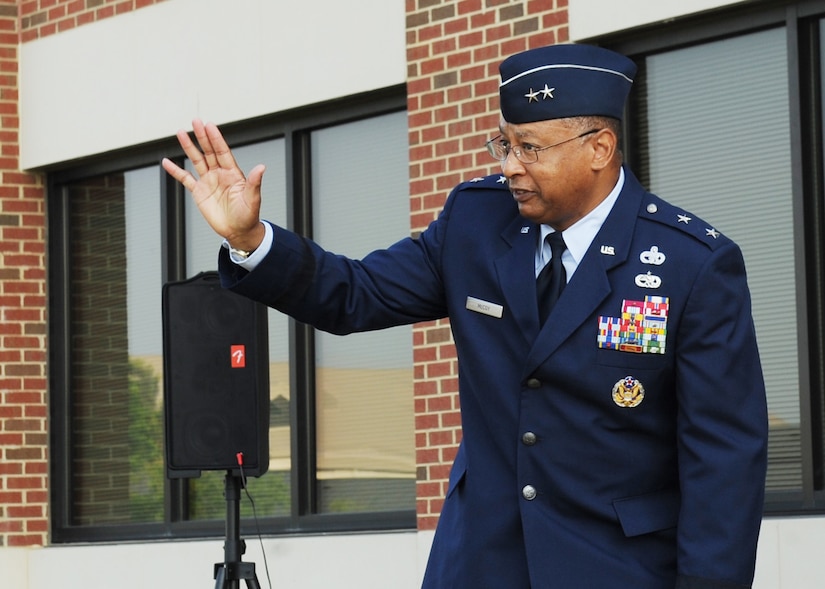 LANGLEY AIR FORCE BASE, Va. -- Maj. Gen. Gary T. McCoy, Air Force Global Logistics Support Center commander, greets Airmen during the ribbon-cutting ceremony for the new 735th Supply Chain Management Group building here June 26. The new building was built to accommodate more employees and improve working conditions for 735th SCMG personnel.  (U.S. Air Force photo/Airman 1st Class Jonathan Koob)
