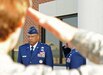 LANGLEY AIR FORCE BASE, Va. -- Maj. Gen. Gary T. McCoy, Air Force Global Logistics Support Center commander, is saluted during the playing of Ruffles and Flourishes at the ribbon-cutting ceremony for the new 735th Supply Chain Management Group building here June 26. The new building was built to accommodate more employees and improve working conditions for 735th SCMG personnel.  (U.S. Air Force photo/Airman 1st Class Jonathan Koob)