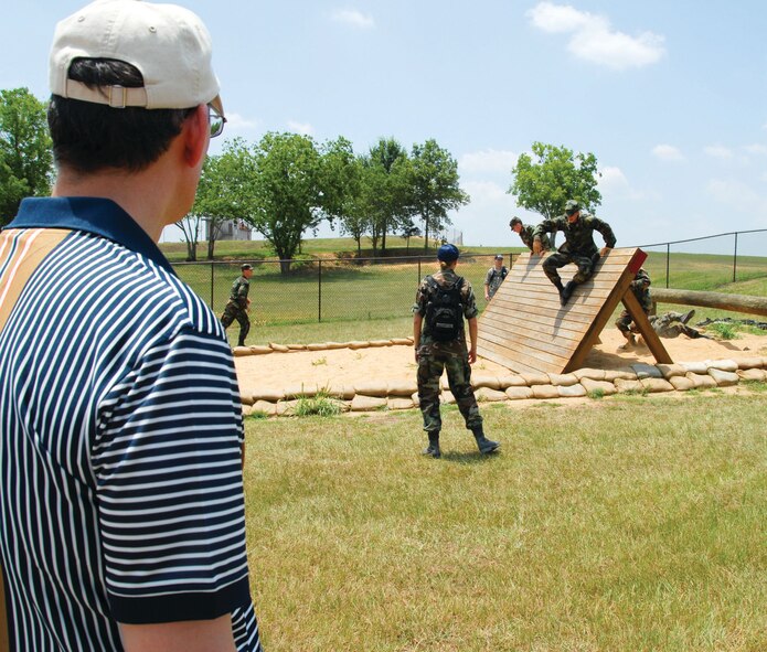 Cadets on the obstacle course at Maxwell's field training site, "Blue Thunder." The cadets are part of the 2009 Field Training for Air Force ROTC cadets from universities around the nation. Field Training is a four-week long program and a requirement towards graduation and ultimately, a commission as a second lieutenant in the Air Force. (U.S. Air Force photo/Jamie Pitcher)