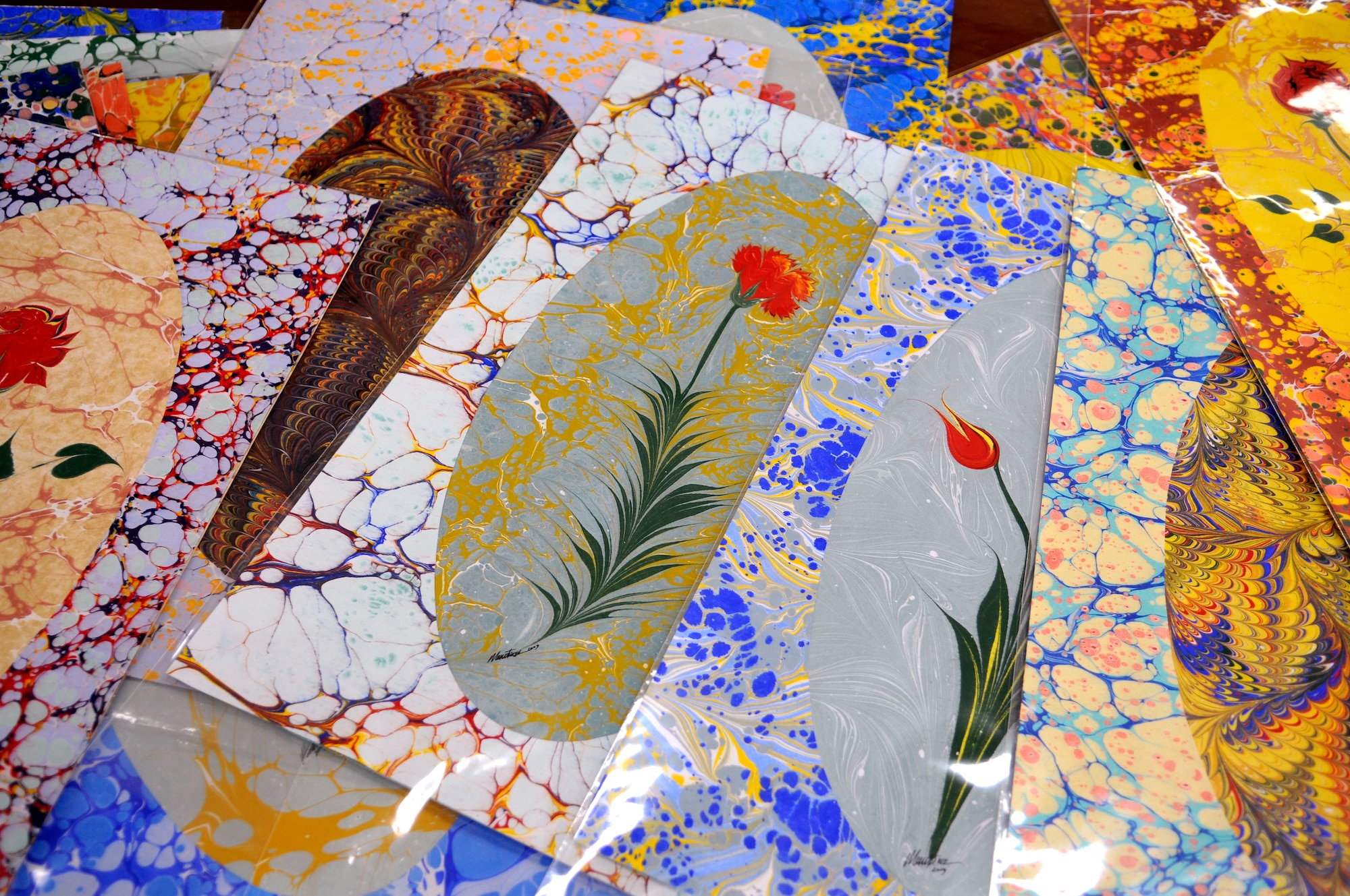 Ebru art created by Mesut Dikel, an Ebru art instructor, is displayed during a class Wednesday, June 24, 2009 at the Arts and Crafts Center here.  Mr. Dikel has been creating Ebru art, a unique Turkish art form, for nearly 24 years.  Ebru, or paper marbling, has been practiced in Turkey since the 15th century and uses all-natural products, from the brushes to the paints.  The center plans to offer the class monthly.  (U.S. Air Force photo/Staff Sgt. Raymond Hoy)