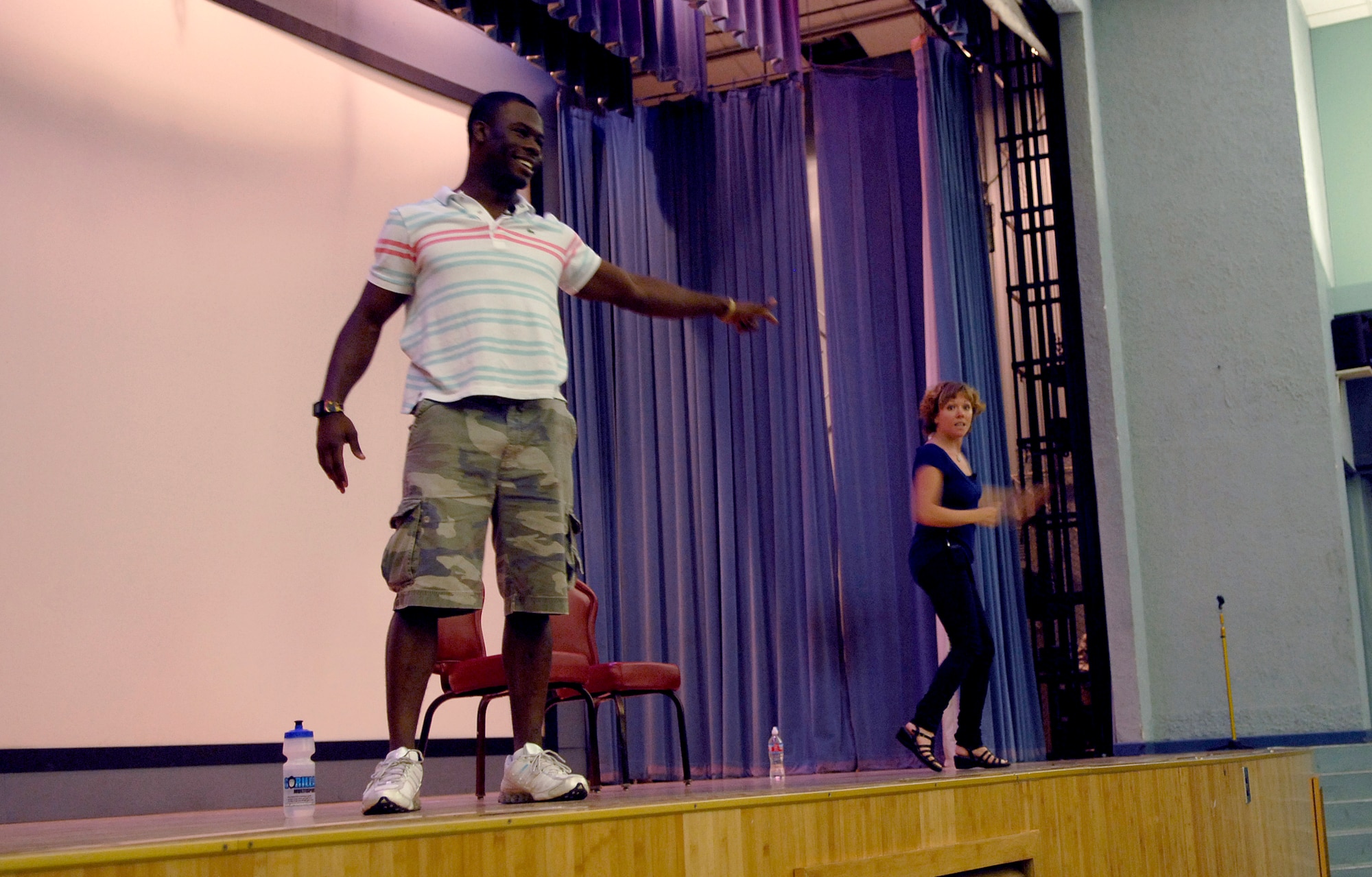 Kyle Terry and Courtney Abbott act out a scene during the show "Sex Signals" at Osan Air Base, June 24. “Sex Signals” is a workshop production that blends different combinations of comedy, education and participation from the audience to address the issues surrounding dating, sex and sexual assault. (U.S. Air Force photo/Staff Sgt. Brian Ferguson)
