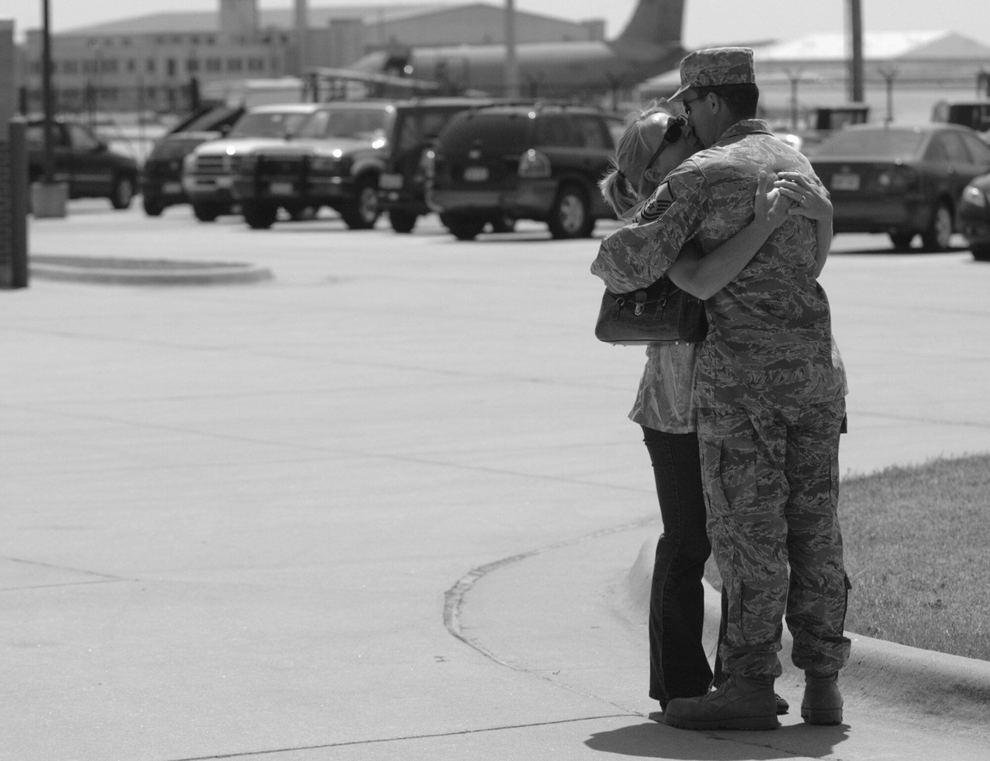 Master Sgt. Jeff Schrier shares a farewell moment with his wife, Lori, before deploying to Southwest Asia on June 27. More than a dozen other Reservists from the 931st Aircraft Maintenance Squadron departed with Sergeant Schrier in support of overseas contingencies. Sergeant Schrier is a communications and navigation team leader for the squadron. (U.S. Air Force photo/Tech. Sgt. Jason Schaap)