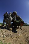 MINOT AIR FORCE BASE, N.D—Members from the 91st Missile Security Forces Squadron, take down a “protestor” during a Nuclear Surety Inspection protest exercise here, June 23.  The “protestors” chained themselves to one of the bases facilities and defaced the area.  2009 was a year that brought progress and a renewed emphasis on safe, secure and reliable nuclear operations. The 91st Missile Wing transitioned to Air Force Global Strike Command with the 5th Bomb Wing scheduled to follow suit in 2010. . (US Air Force photo by Tech. Sgt. Lee A. Osberry, Jr.)