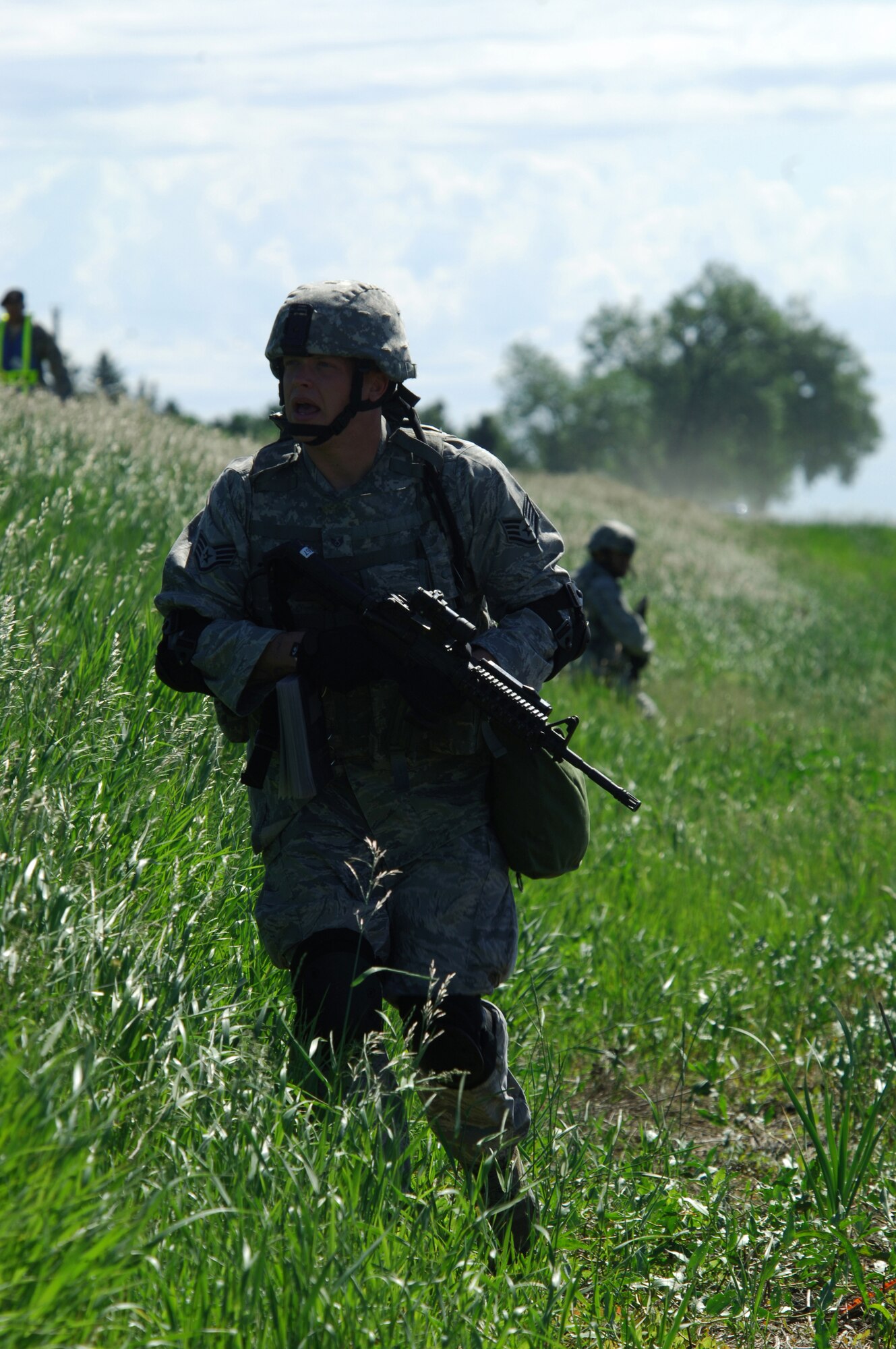 MINOT AIR FORCE BASE, N.D. -- Staff Sgt. Christopher Wilder, 91st Missile Security Forces Squadron member, moves into position during a Nuclear Surety Inspection protest exercise here June 23.  An NSI is designed to evaluate a unit's readiness to execute nuclear operations and takes place at least every 18 months. (U.S. Air Force Photo by Tech Sgt. Lee A. Osberry Jr.)