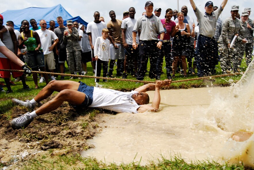 A participant is dragged in the mud during the tug-of-war competition. The 43rd Civil Engineer Squadron won overall in the event
