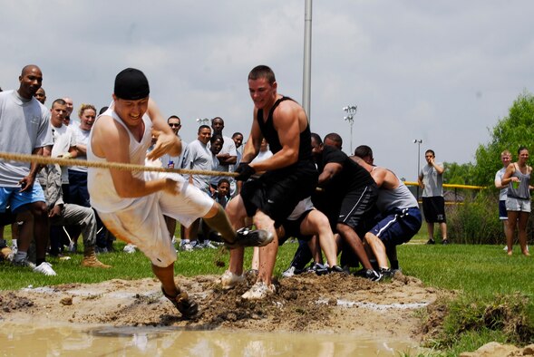 A participant is dragged in the mud during the tug-of-war competition. The 43rd Civil Engineer Squadron won overall in the event.