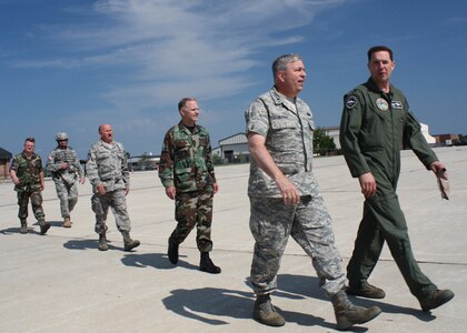 GRISSOM AIR RESERVE BASE, Ind., -- Brig. Gen. Dean Despinoy, 434th Air Refueling Wing Commander, and other members from Grissom follow Col. Martin Doebel, National Airborne Operations Center Commander, for a tour on the NAOC's E-4B.  The aircraft visited Grissom ARB recently.