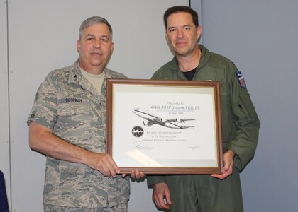 GRISSOM AIR RESERVE BASE, Ind., -- Brig. Gen. Dean Despinoy (left), 434th Air Refueling Wing Commander, accepts a special framed certificate from Col. Martin Doebel, National Airborne Operations Center Commander, while visiting the E-4B aircraft during its stop at Grissom ARB.