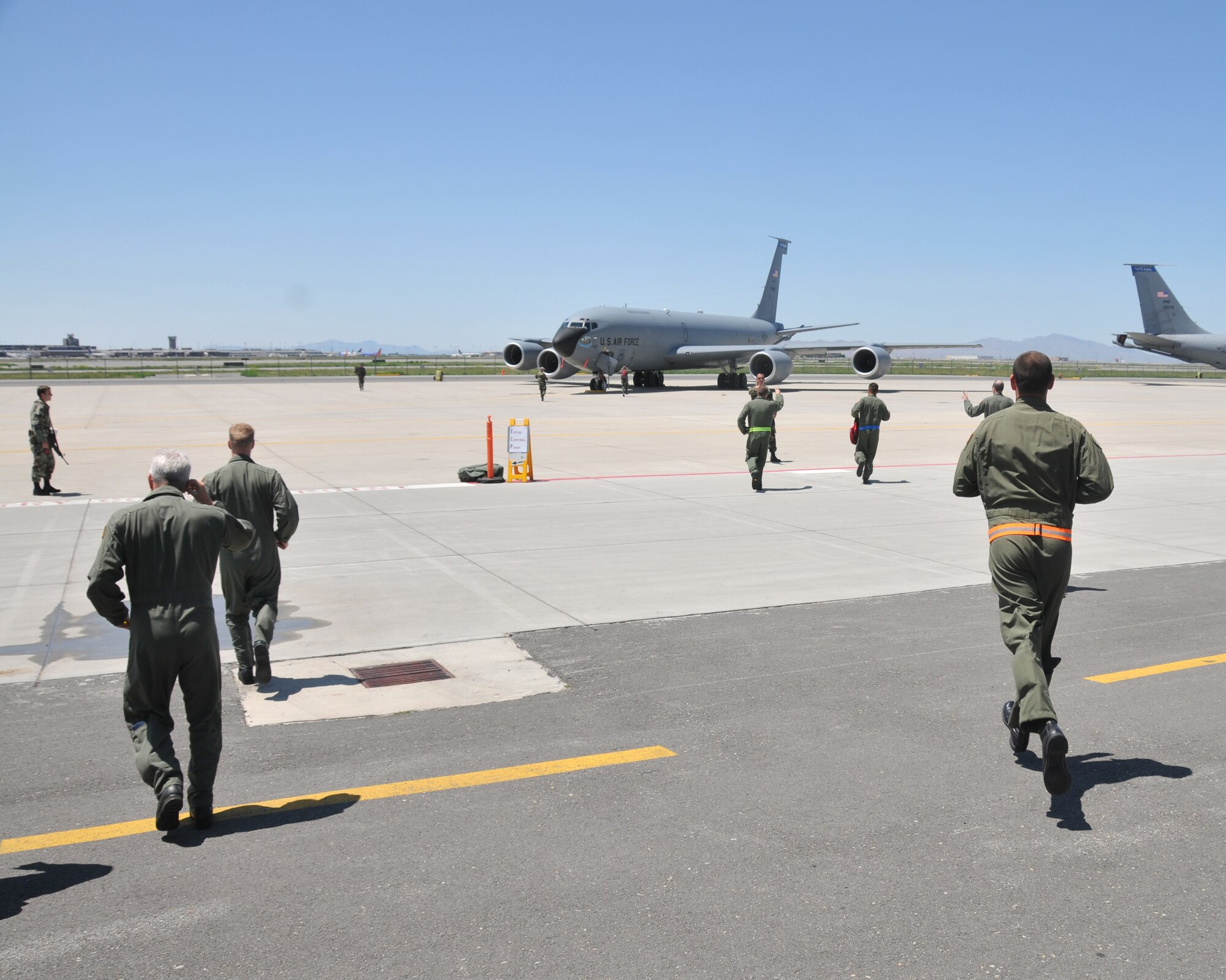 SALT LAKE CITY - Members of the 191st Air Refueling Squadron run to their aircraft June 27 as part of the wing?s participation in the Global Thunder exercise.  Global Thunder is U.S. Strategic Command?s major nuclear exercise that includes command post activities as well as force generation and flying operations. The 151st ARW's nuclear support mission includes air refueling of flying assets.  U.S. Air Force photo by Tech. Sgt. Michael D Evans.