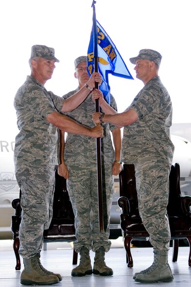 Col. Kevin J. Kilb, right, assumes command of the 62nd Airlift Wing from Maj. Gen. Winfield W. Scott III, left, 18th Air Force commander, June 26. (U.S. Air Force photo/Randy White) 