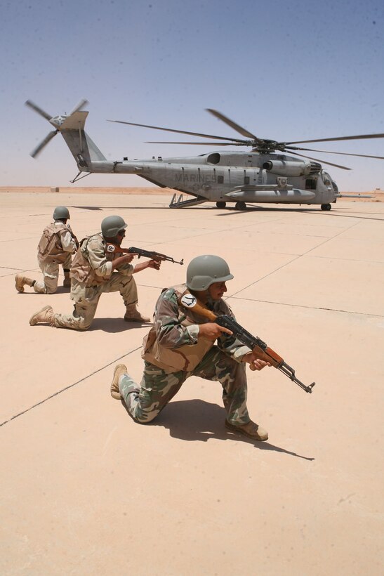 Iraqi commandos from the Commando Company, 29th Brigade, 7th Iraqi Army Division, establish security for a CH-53E Super Stallion during a training exercise at Mudaysis Airfield, July 1, 2009.  This exercise was a part of a one-month training package involving the commandos and Marines of Reconnaissance Platoon, Regimental Combat Team 8.