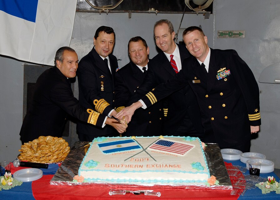 (Pictured from left to right) Rear Adm. Edwardo Castro Rivas, Comandante de la Flota de Mar , Vice Adm. Carlos Paz,  Comandante de Operaciones Navales, Capt. Brad Williamson, Commodore Destroyer Squadron TWO, Thomas Kelly, Charge D'affaires, and Cmdr. Daniel Blackburn, Commanding Officer USS Oak Hill (LSD 51) cut the cake during a reception onboard USS Oak Hill June 29, 2009. The USS Oak Hill will also support the U.S Marine Corps Forces, South multinational combined exercise Southern Exchange 2009 at the Divisão Anfíbia and the island of Marambaia, Rio de Janeiro from July 13-31. (U.S. Navy photo by Mass Communication Specialist 3rd Class (SW) Cory Rose/RELEASED).