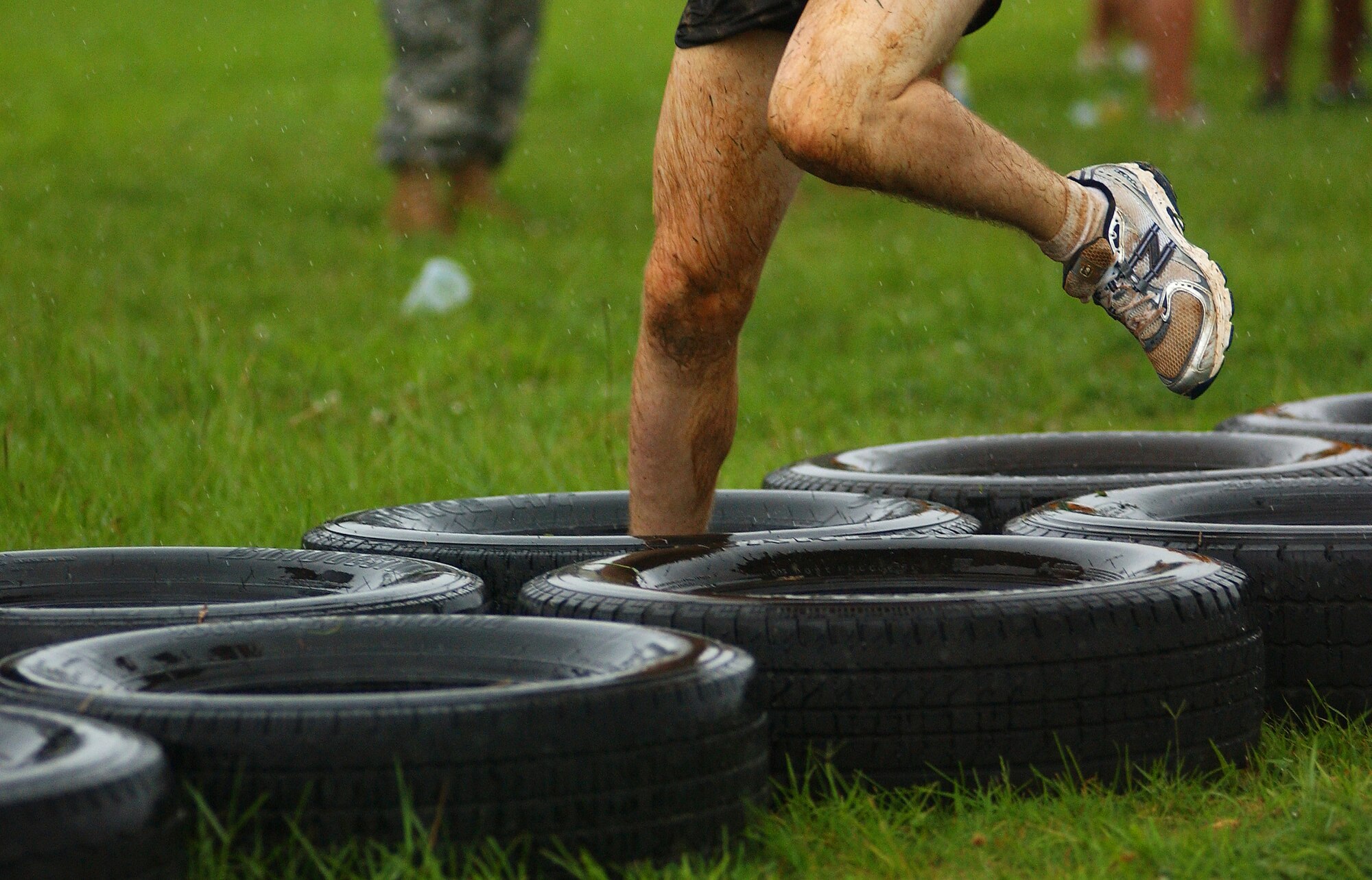 Various military branches and units compete in an obstacle course during the Battle of the Services Fitness Challenge 2009 at Kadena Air Base, Japan June 26.
(U.S. Air Force photo/Tech. Sgt. Rey Ramon)              