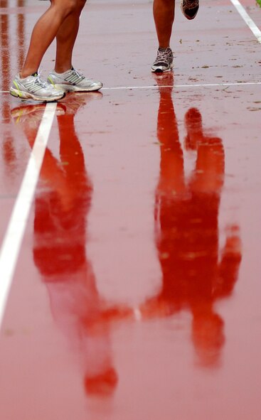 Various military branches and units compete in a relay run during the Battle of the Services Fitness Challenge 2009 at Kadena Air Base, Japan June 26.
(U.S. Air Force photo/Tech. Sgt. Rey Ramon)               