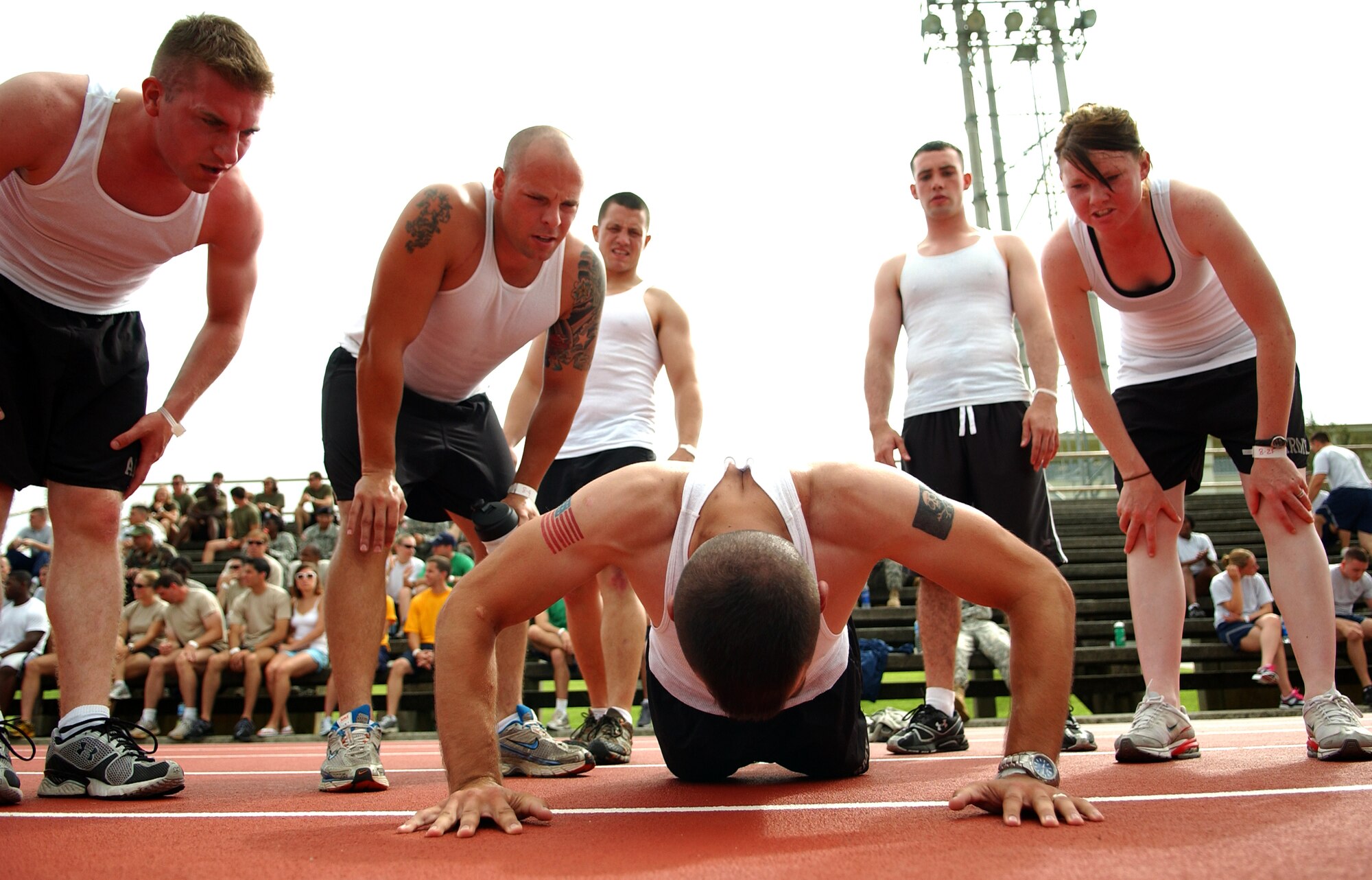 Army soldiers root for one of their own during a push-up competition in the Battle of the Services Fitness Challenge 2009 at Kadena Air Base, Japan June 26.
(U.S. Air Force photo/Tech. Sgt. Rey Ramon)  