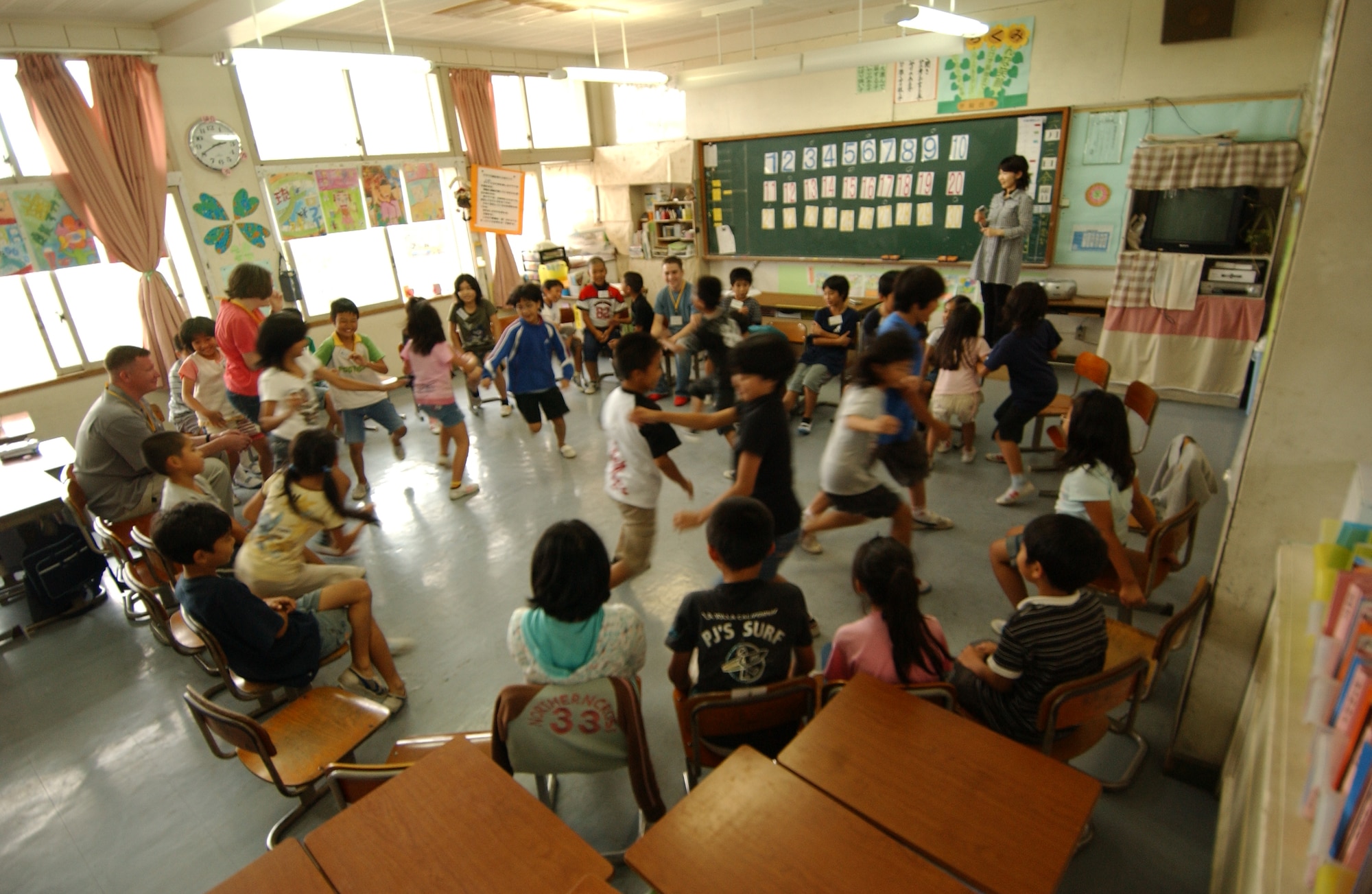 The local children from Takahara Elementary School enjoy a day of learning English through motivational games with volunteers from Kadena Air Base, Japan June 12. 
(U.S. Air Force photo/Tech. Sgt. Rey Ramon)    