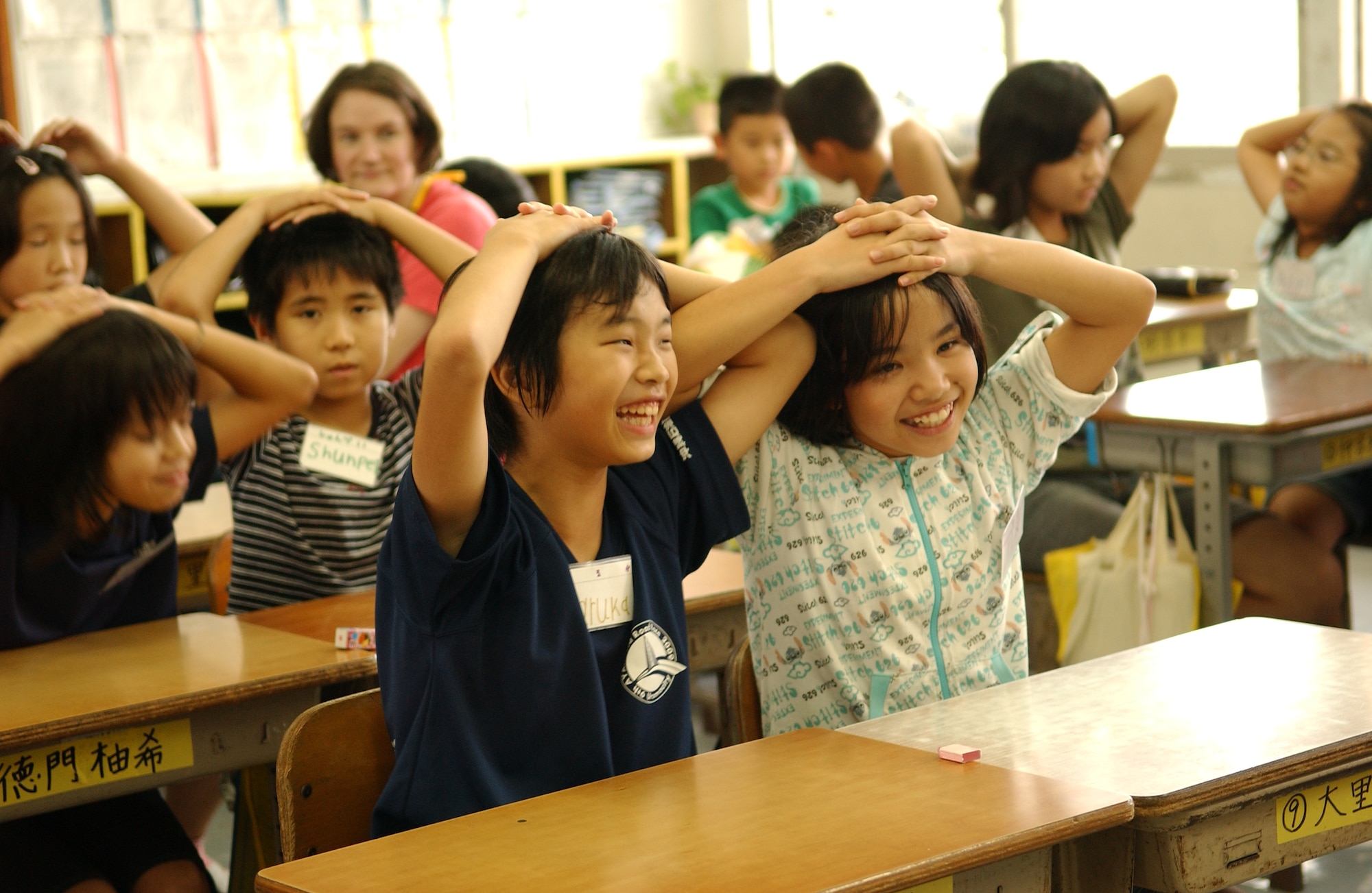 The local children from Takahara Elementary School enjoy a day of learning English through motivational games with volunteers from Kadena Air Base, Japan June 12. 
(U.S. Air Force photo/Tech. Sgt. Rey Ramon)  