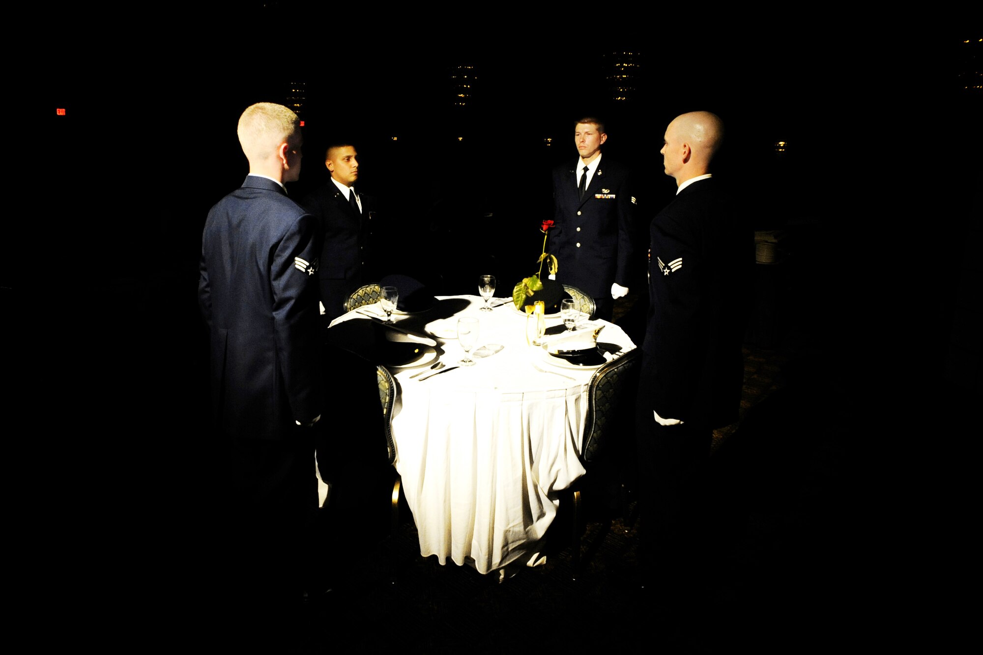MISAWA AIR BASE, Japan -- Members of the Airman Leadership School Class 09-E take part in a POW/MIA ceremony before graduating June 25, 2009. The vacant table serves as a symbolic remembrance for prisoners of war and those missing in action.  (U.S. Air Force photo/Senior Airman Jamal D. Sutter)