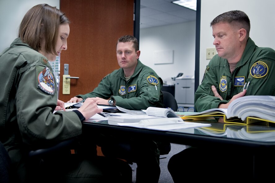 Maj. Jen Moore, 1st Lt. Brent Smith and Master Sgt. Daniel Brown discuss their flight plans during a pre-flight briefing.  Major Moore and Lieutenant Smith are KC-135 Stratotanker pilots and Sergeant Brown is a boom operator assigned to the 126th Air Refueling Wing.  (U. S. Air Force photo/Staff Sgt. Desiree N. Palacios)