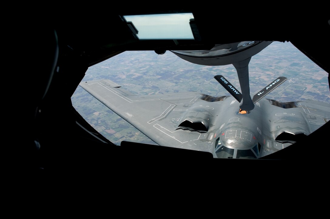 A KC-135 Stratotanker's flying boom awaits a B-2 Spirit to be refueled during an air refueling mission. The B-2 Spirit is from Whiteman Air Force Base, Mo. and the KC-135 Stratotanker is assigned to the 126th Air Refueling Wing, Scott Air  Force Base, Ill. (U. S. Air Force photo/Staff Sgt. Desiree N. Palacios)