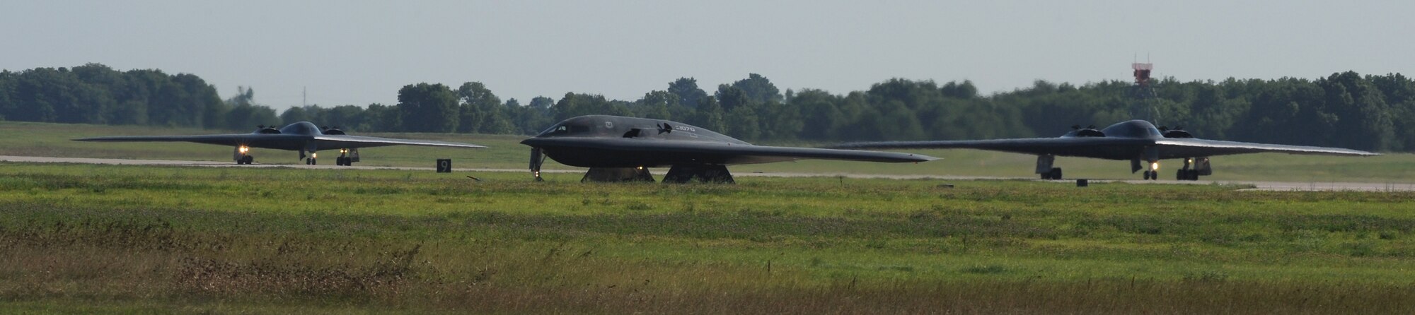 WHITEMAN AIR FORCE BASE, Mo. - Three B-2 Stealth Bombers taxi as they participate in day-to- day training operations at here, June 29. The B-2 is a piece of Team Whiteman and the crews that it takes to operate and launch this craft is a very valuable asset. (U.S. Air Force photo/Airman 1st Class Carlin Leslie) 