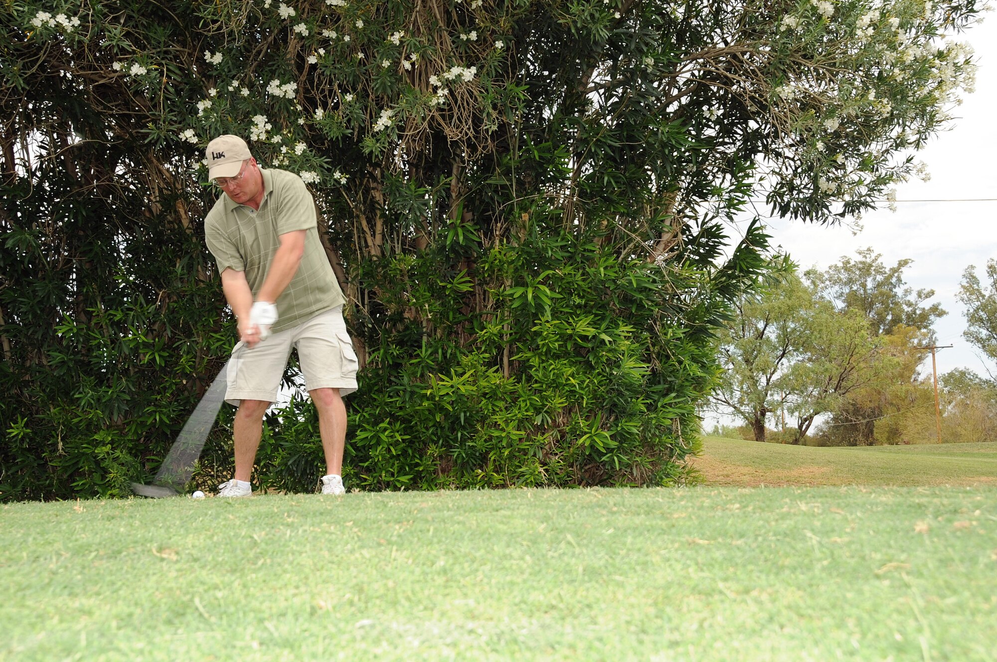 Master Sgt. Merle Hudson, 355th Security Forces Squadron, swings at a golf ball during a golf tournament here June 26. The golf tournament was a fund raiser help to support this years Senior Non-Commisioned Officer Induction Ceremony. (U.S. Air Force photo/Master Sgt. Heather Cabral)