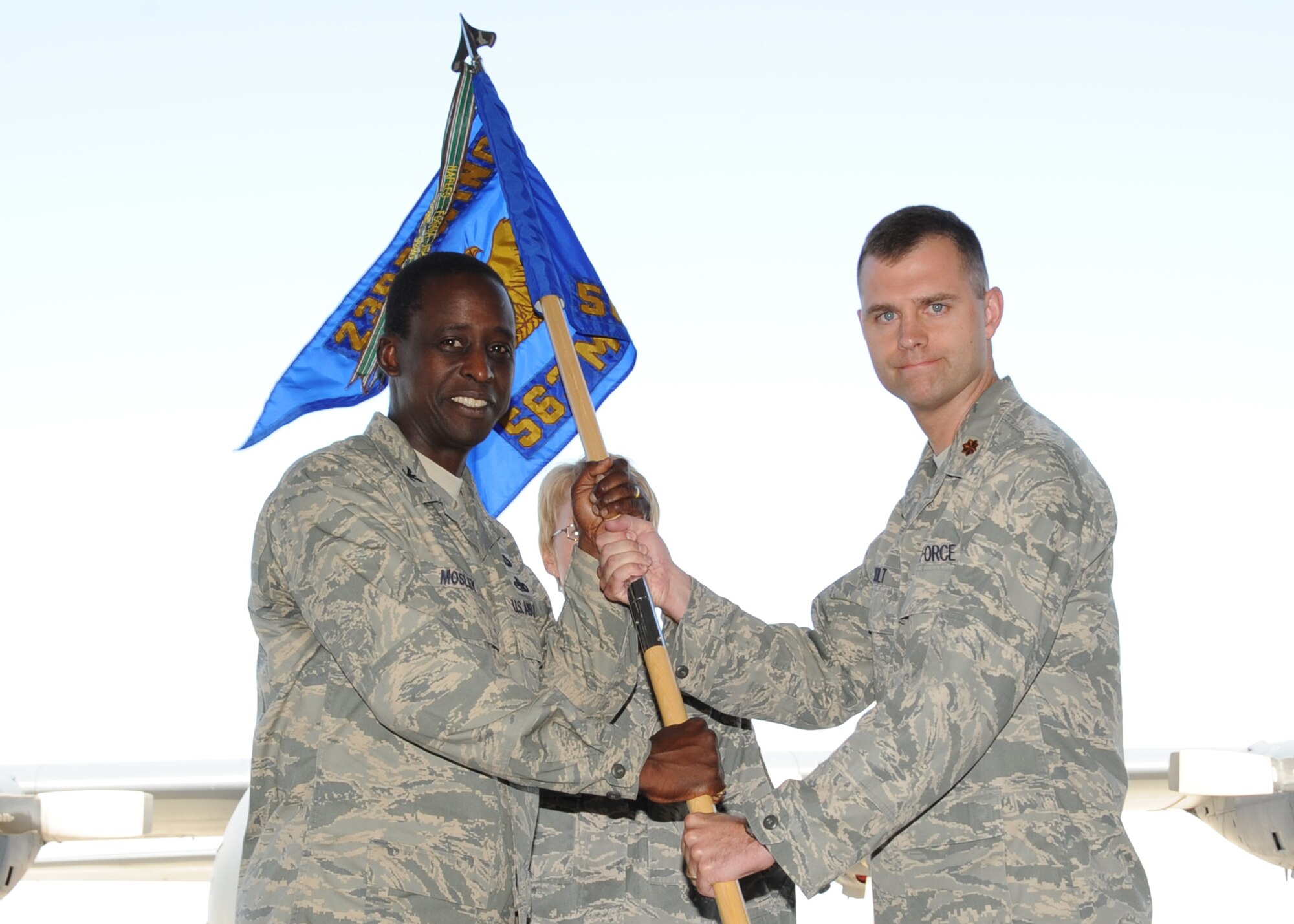 Maj. Chad Holt receives the 563rd Maintenance Squadron guidon from Col. Darrel Mosley, 23rd Maintenance Group commander from Moody Air Force Base, Ga., during the change-of-command ceremony here June 29. Major Holt assumed command of the 563rd MXS from Lt. Col. Allan Hodge. (U.S. Air Force photo/Master Sgt. Heather Cabral)
