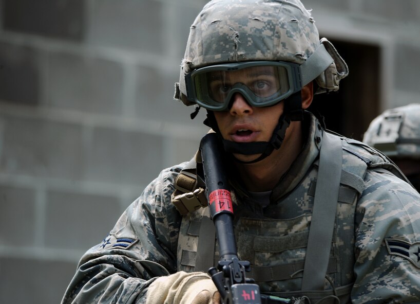 MOODY AIR FORCE BASE, Ga. -- Airman 1st Class Peter Pazzanita, 823rd Security Forces Squadron combat apprentice, exits a cleared building during a training demonstration here June 24. The 820th Security Forces Group demonstrated the capabilities of their ground forces to U.S. Air Force Academy cadets as part of a program called Operation Air Force. (U.S. Air Force photo by Airman 1st Class Joshua Green)