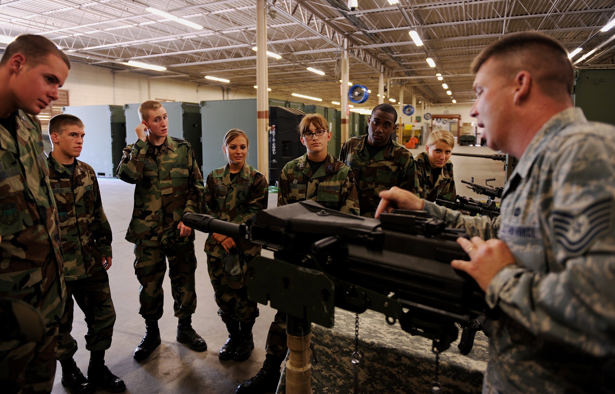 MOODY AIR FORCE BASE, Ga. -- Tech Sgt. Vernon Bird, 820th Combat Operations Squadron combat arms trainer, explains the mechanics of a weapon to U.S. Air Force Academy cadets here June 24. Cadets are immersed into the Air Force way of life on an Air Force base through the use of tours, receiving hands-on experience and by shadowing Air Force personnel in a variety of career fields. (U.S. Air Force photo by Airman 1st Class Joshua Green)
