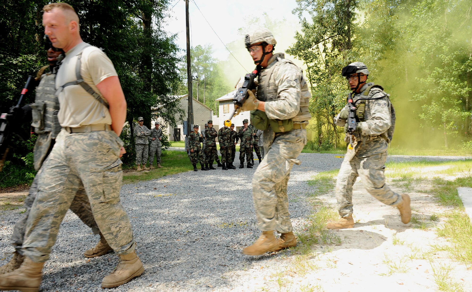 MOODY AIR FORCE BASE, Ga. -- U.S. Air Force Academy cadets observe as Airmen from the 820th Security Forces Group demonstrate how to apprehend terrorists here June 24. The U.S. Air Force Academy cadets are visiting Moody as part of Operation Air Force, a two-and-a half-week program designed to showcase what the Air Force has to offer and allows them to experience different career fields. (U.S. Air Force photo by Airman 1st Class Joshua Green) 