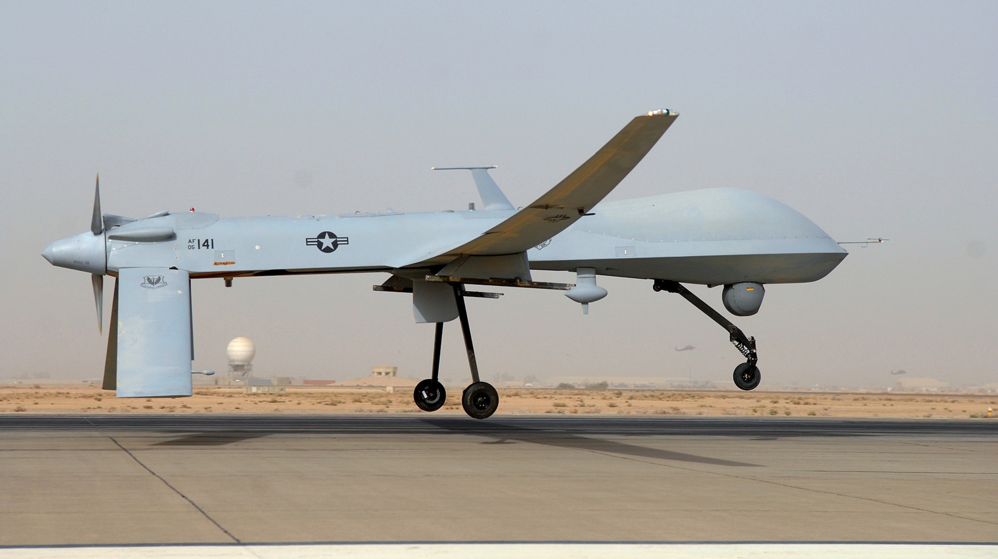 An MQ-1 Predator takes off in support of Operation Iraqi Freedom. The Predator carries the multi-spectral targeting system with inherent AGM-114 Hellfire missile targeting capability and integrates electro-optical, infrared, laser designator and laser illuminator into a single sensor package. (U.S. Air Force photo/Senior Airman Julianne Showalter)