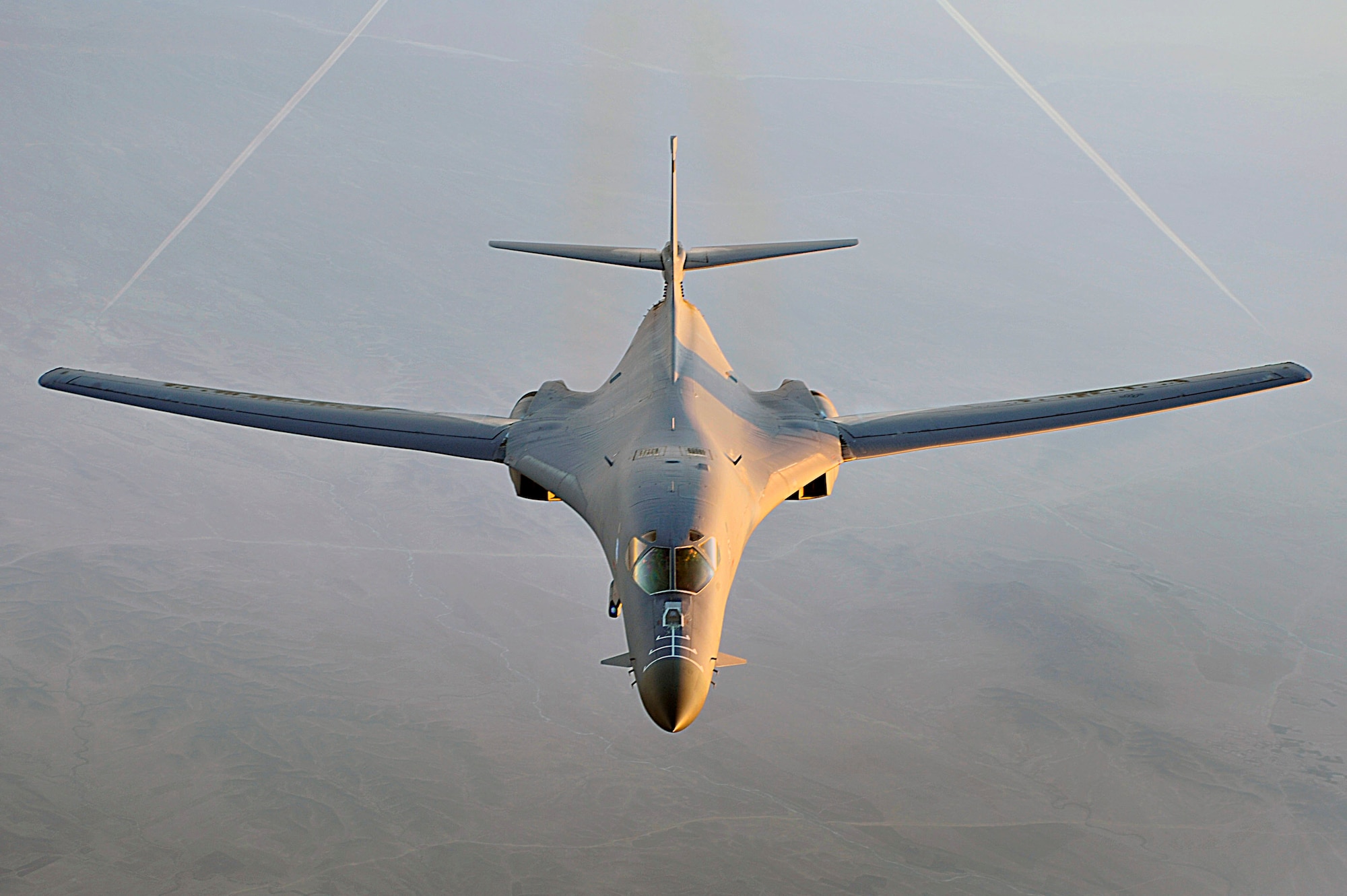 A B-1B Lancer flies a combat patrol over Afghanistan in support of Operation Enduring Freedom. The B-1B has the capability to carry guided and unguided weapons and deliver massive quantities of precision and non-precision weapons against specific targets. (U.S. Air Force photo/Staff Sgt. Aaron Allmon)  