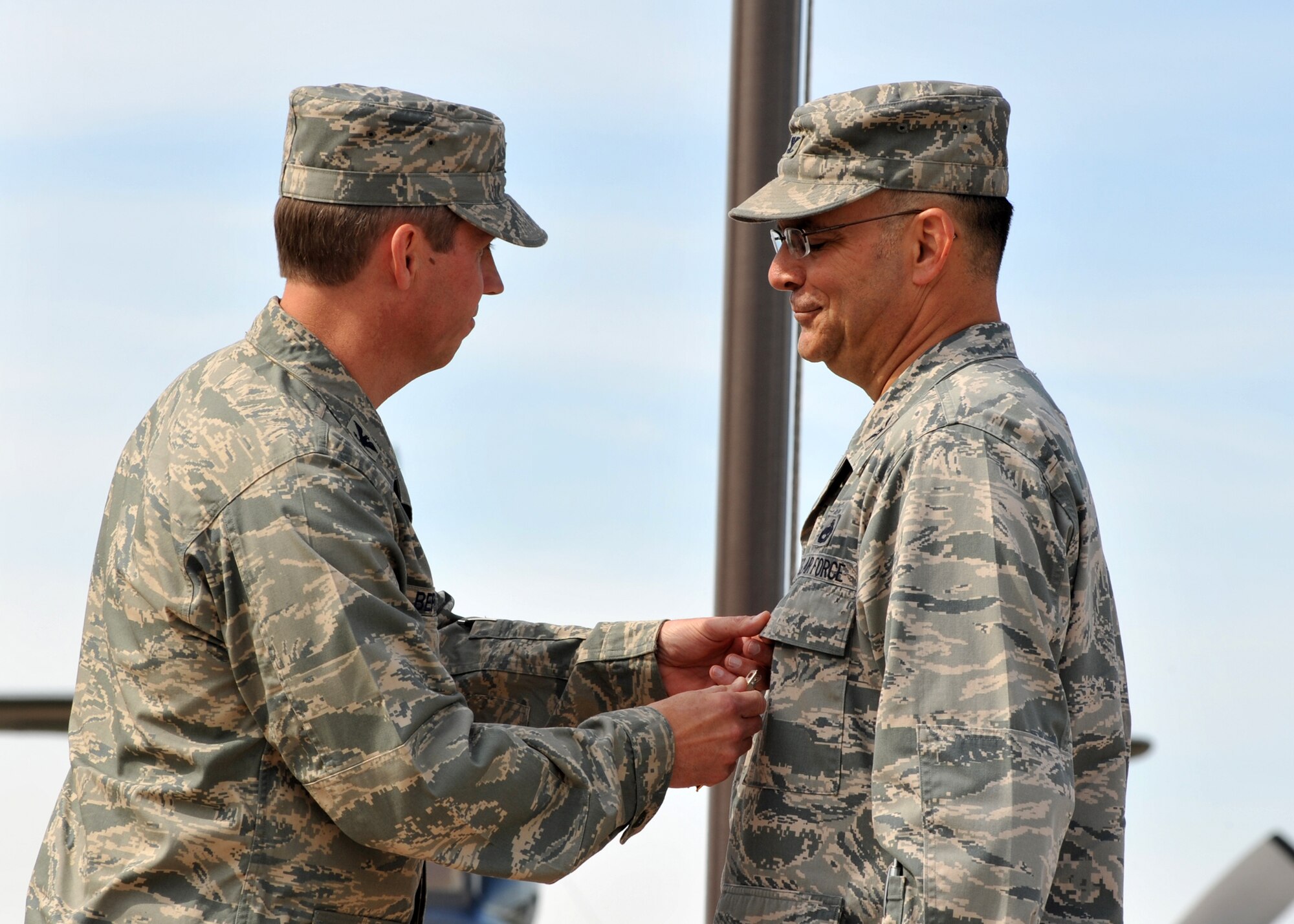ELMENDORF AIR FORCE BASE, Alaska -- Col. Thomas Bergeson pins the Meritorious Service medal on Col. Michael Arceneaux during the 3rd Maintenance Group change of command June 25. Bergeson is the 3rd Wing commander. (U.S. Air Force photo/Senior Airman Laura Turner)