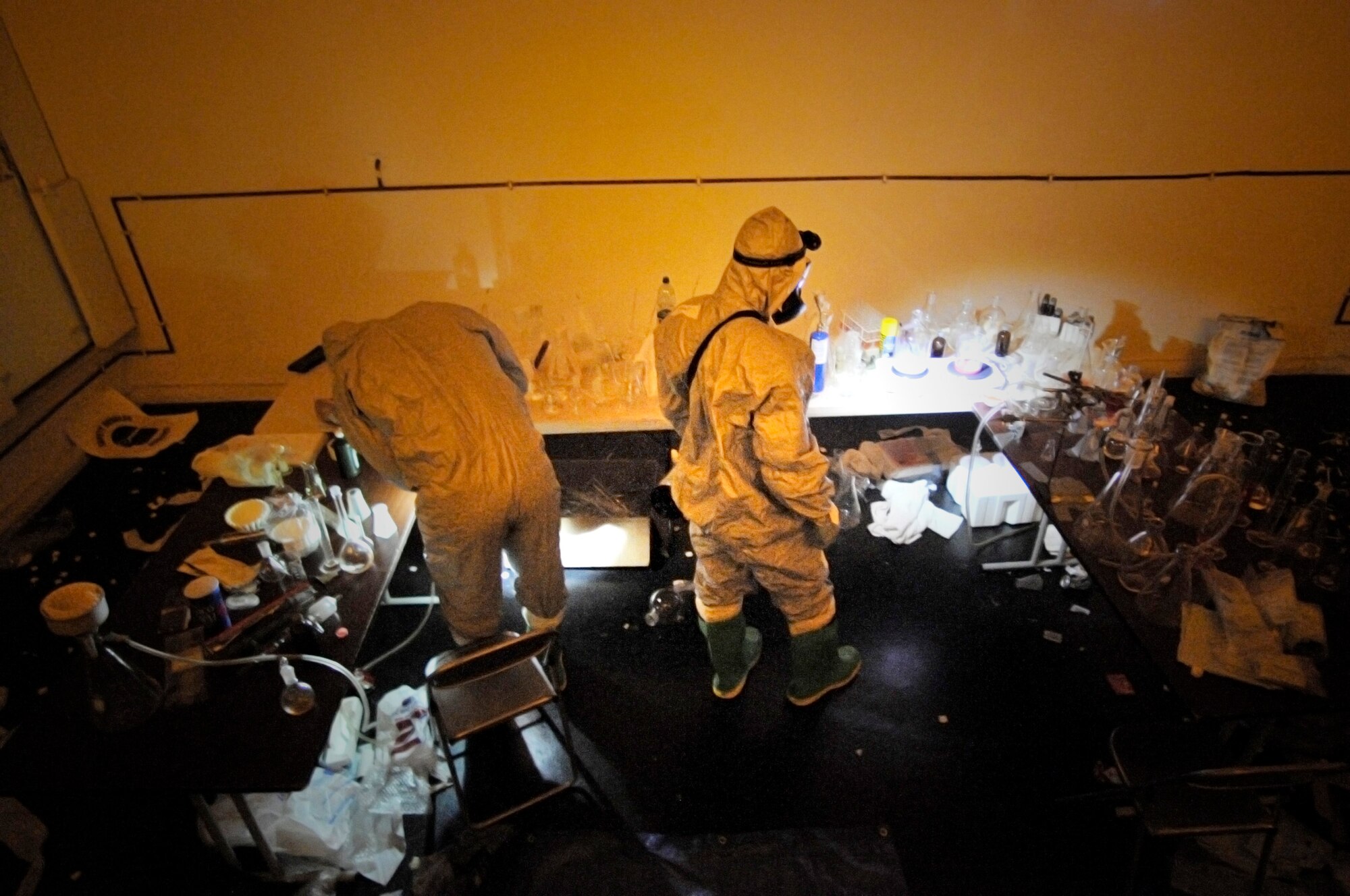 Airman 1st Class Mathew Kindoll and Staff Sgt. Christopher McFefries take a challenge in Level A suits during the 2009 Chemical, Biological, Radiological, and Nuclear Challenge June 22 at Ramstein Air Base, Germany. The CBRN Challenge consisted of six teams going head to head in six different scenarios, an equipment olympic challenge, and land navigation challenge. Airman Kindoll is assigned to the 48th Civil Engineer Squadron, and Sergeant McFefries is assigned to the 100th Civil Engineer Squadron. (U.S. Air Force photo/Staff Sgt. Stephen J. Otero) 
