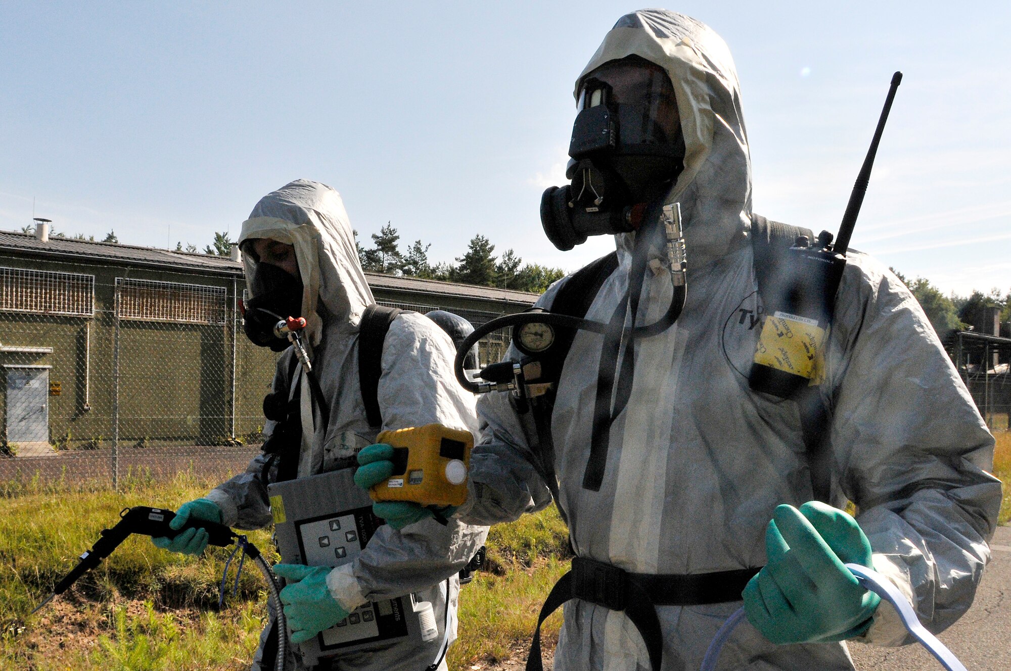 Airman 1st Class Mathew Kindoll and Staff Sgt. Christopher McFefries take a challenge in Level A suits during the 2009 Chemical, Biological, Radiological, and Nuclear Challenge June 22 at Ramstein Air Base, Germany. The CBRN Challenge consisted of six teams going head to head in six different scenarios. Airman Kindoll is assigned to the 48th Civil Engineer Squadron, and Sergeant McFefries is assigned to the 100th Civil Engineer Squadron. (U.S. Air Force photo/Staff Sgt. Stephen J. Otero) 
