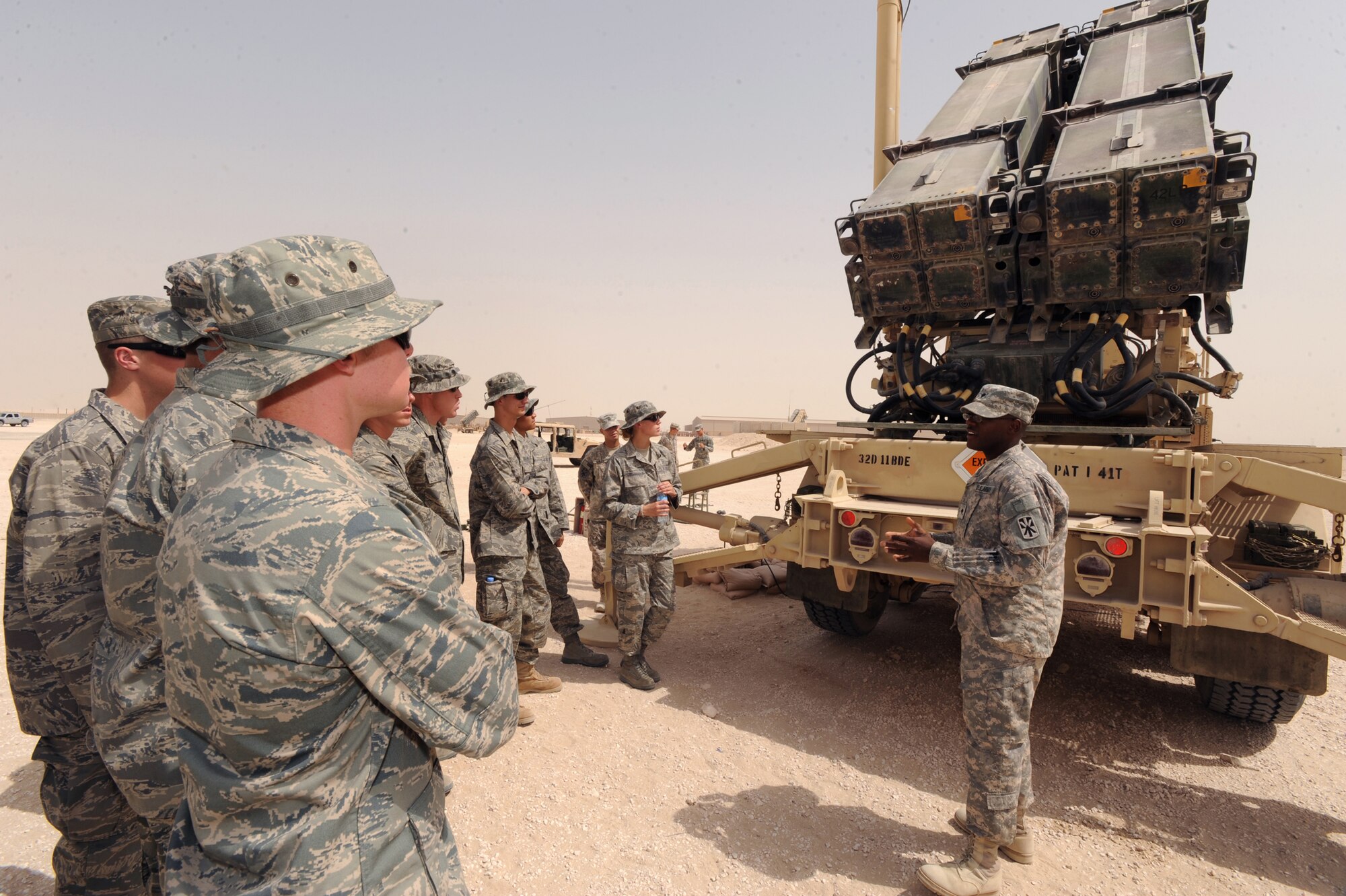 United States Army Specialist John Dodson, Charlie 143 Air Defense Artillery 11th Brigade, briefs Cadets visiting from the Air Force Academy on the mission of the Army here, 24 June, 2009, in and undisclosed location in Southwest Asia.  The cadets are part a program called Operation Air Force, which gives them exposure to the operational side of the Air Force and deployed locations before being commissioned.  Specialist Dodson hails from Lynchburg Va. and is deployed from Fort Bliss, Texas, in support of Operations Iraqi and Enduring Freedom and Combined Joint Task Force - Horn of Africa.  (U.S. Air Force Photo by Staff Sgt. Joshua Garcia/released)