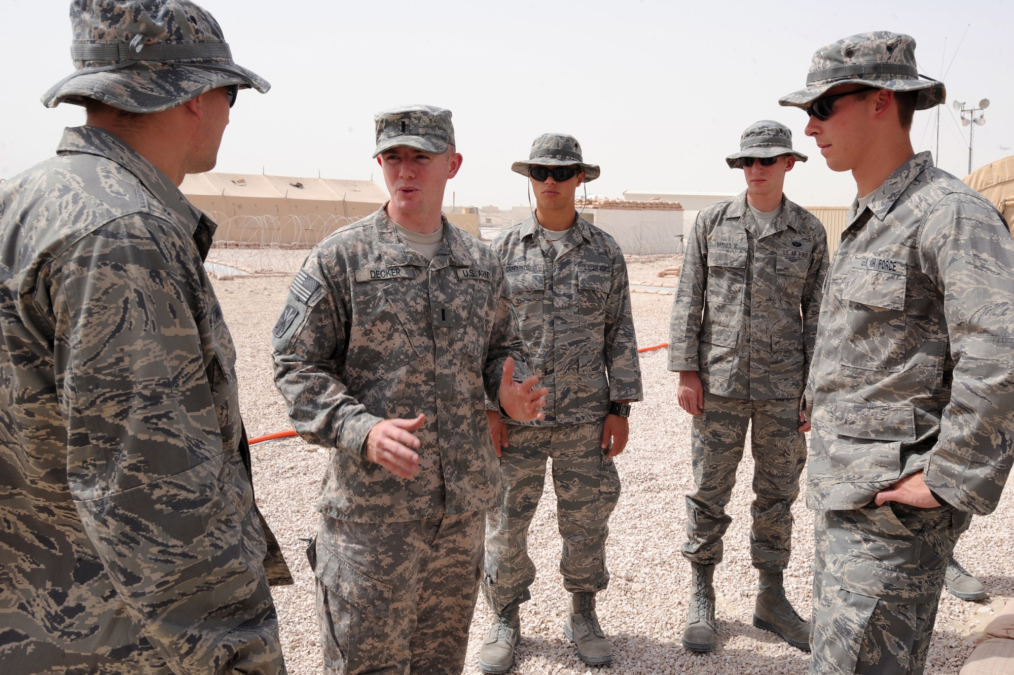 Army First Lieutenant Christian Decker, Charlie 143 Air Defense Artillery 11th Brigade, briefs Cadets visiting from the Air Force Academy on the mission of the Army here, 24 June, 2009, in and undisclosed location in Southwest Asia.  The cadets are part a program called Operation Air Force, which gives them exposure to the operational side of the Air Force and deployed locations before being commissioned.  Lieutenant Decker hails from Howell, N.J. and is deployed from Fort Bliss, Texas in support of Operations Iraqi and Enduring Freedom and Combined Joint Task Force - Horn of Africa.  (U.S. Air Force Photo by Staff Sgt. Joshua Garcia/released)