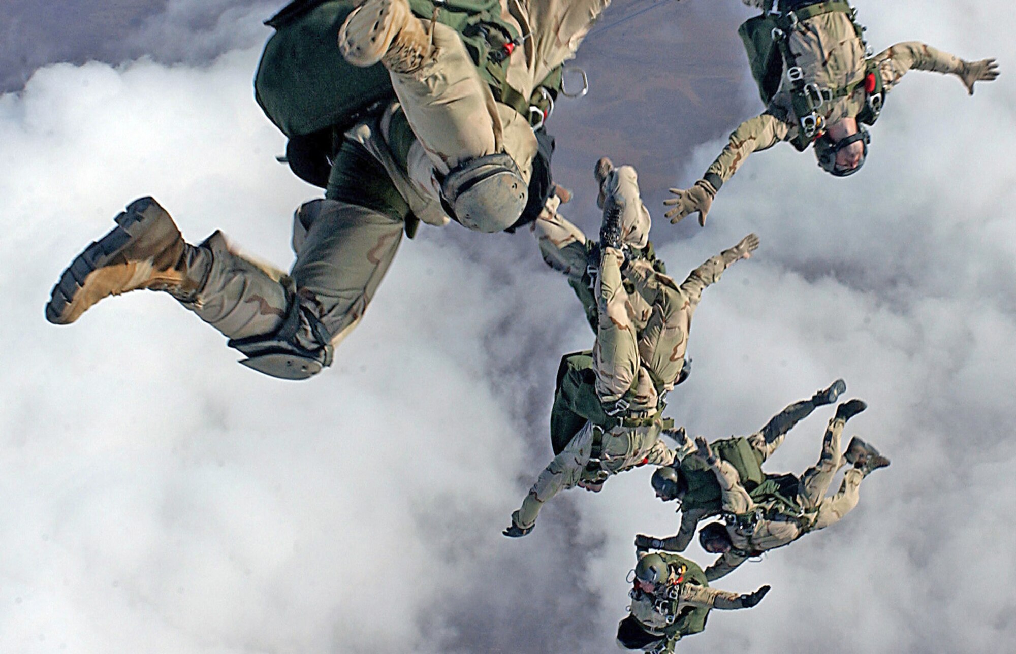 Pararescuemen jump from a HC-130P/N for a high-altitude, low ppening free fall drop from 12,999 feet in support of Operation Enduring Freedom. The Airmen are assigned to the 38th Rescue Squadron and the 58th Rescue Squadron from Nellis Air Force Base, Nev. (U.S. Air Force photo/Staff Sgt. Jeremy T. Lock)