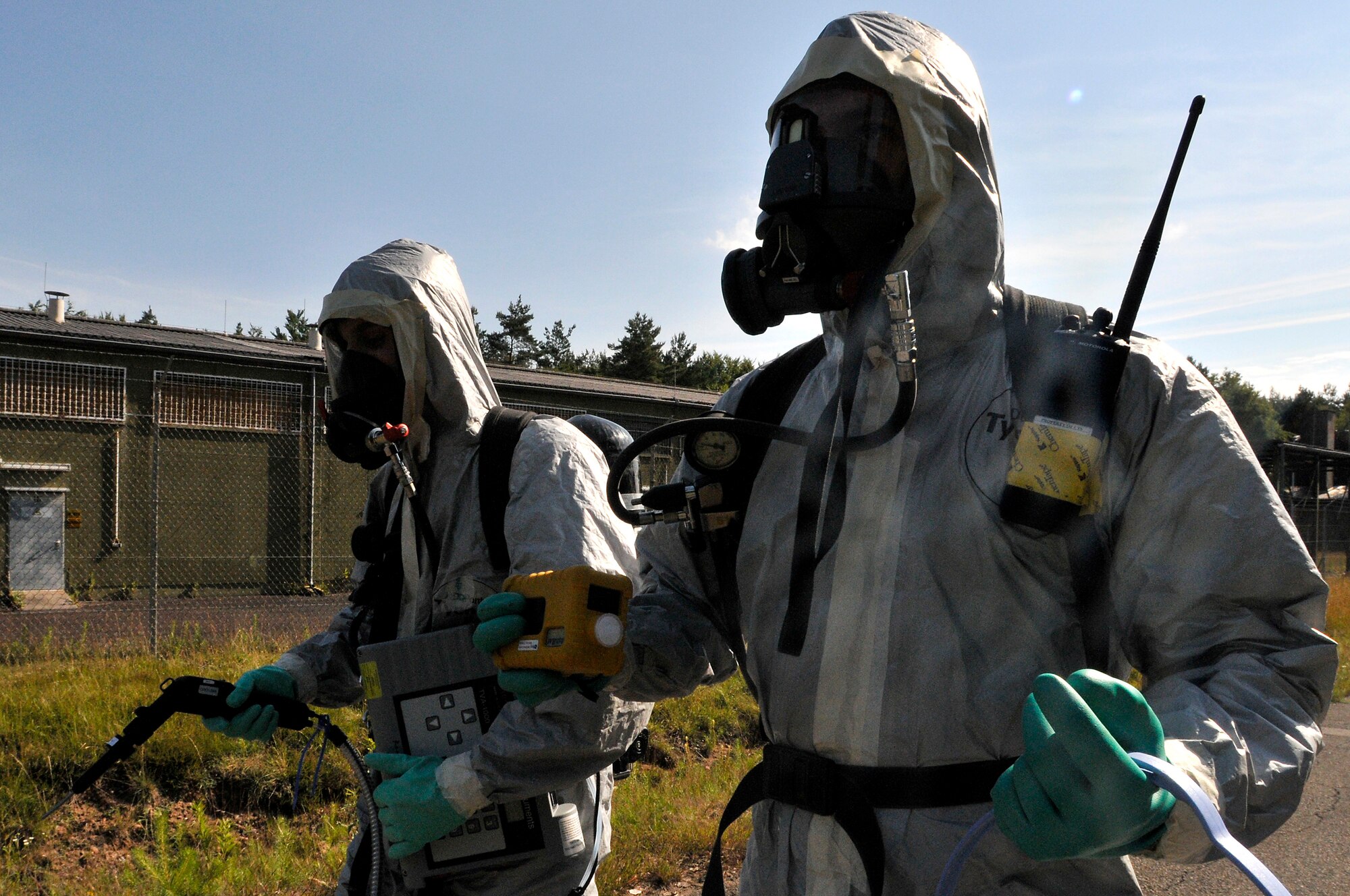 U.S. Air Force Airman 1st Class Mathew Kindoll, 48th Civil Engineer Squadron, and Staff Sgt. Christopher McFefries, 100th Civil Engineer Squadron, take a challenge in Level A suits during the 2009 Chemical, Biological, Radiological, and Nuclear Challenge at Ramstein Air Base, Germany, June 22, 2009. The CBRN Challenge consisted of 6 teams going head to head in 6 different scenarios, an equipment olympic challenge, and land navigation challenge.(U.S. Air Force photo by Staff Sgt. Stephen J. Otero)