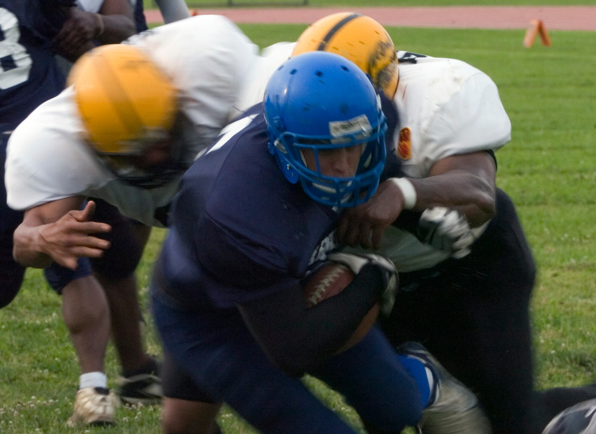 YOKOTA AIR BASE, Japan -- Warriors' running back Kevin Fortin bulls his way into the end zone from 5-yards out for Yokota's first score June 27 in a 12-6 win over the Torii Station Wolfpack in U.S. Forces Japan-American Football League action at Bonk Field. Fortin also had an 80-yard touchdown scamper to help Yokota improve to 2-3 on the season. (U.S. Air Force photo/Master Sgt. Matt Summers)  