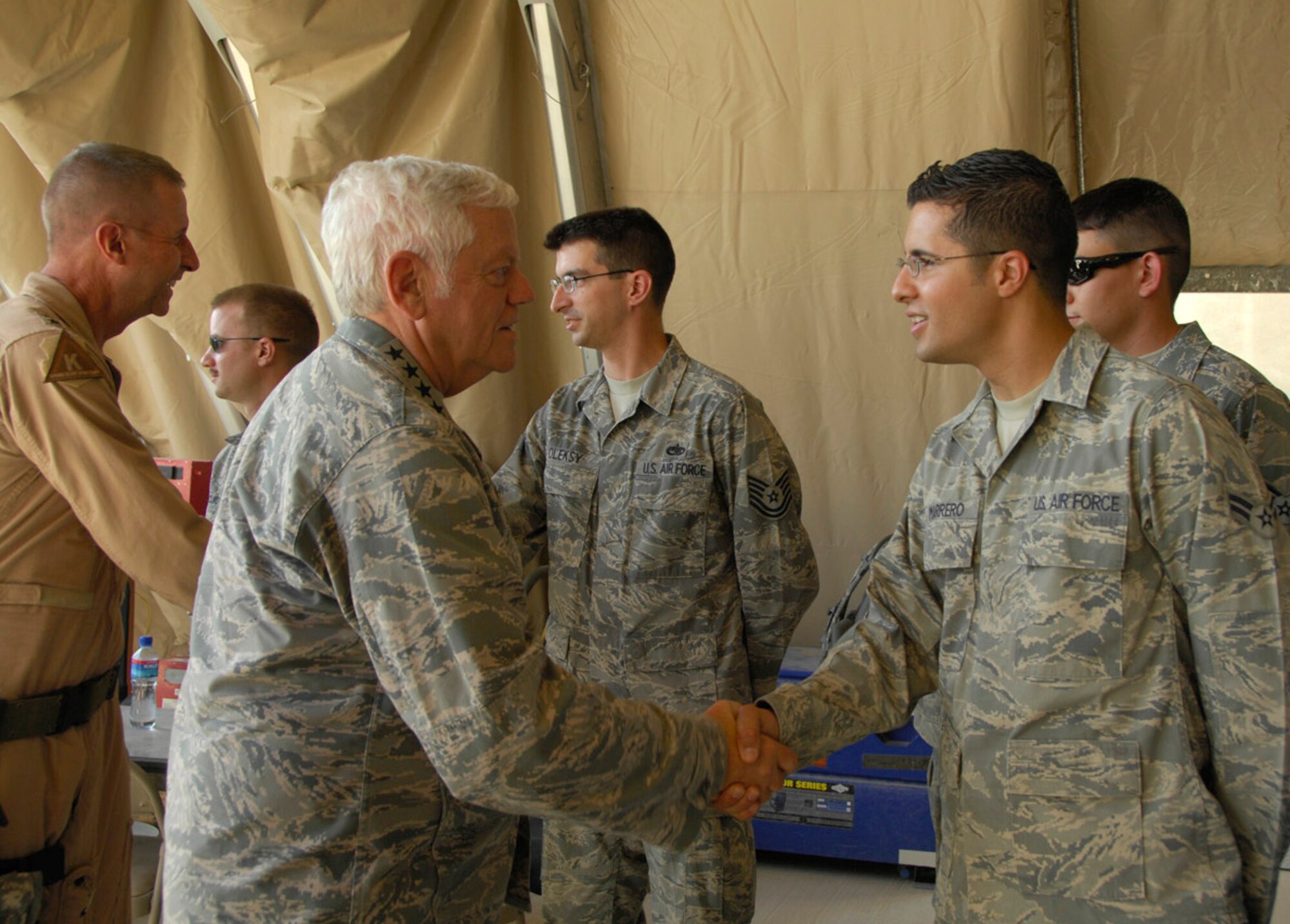 KANDAHAR AIR FIELD, Afghanistan -  Gen. Arthur Lichte, Air Mobility Command commander, meets and greets Airmen of the 772nd Expeditionary Airlift Squadron, 451st Air Expeditionary Group, here June 26, 2009 as part of a short visit to see and discuss air mobility operations issues and concerns in Afghanistan. (U.S. Air Force photo by 1st Lt. Noelle Caldwell)