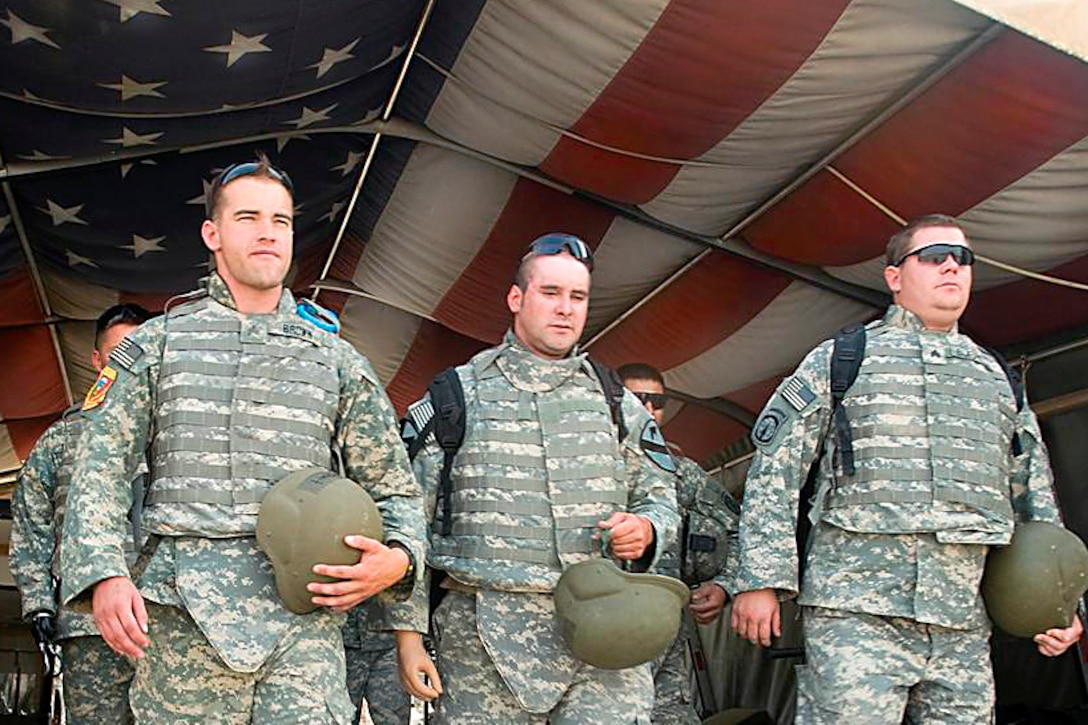 Left to right; U.S. Army Sgt. Robert Brown, retired Staff Sgt. Bradley ...