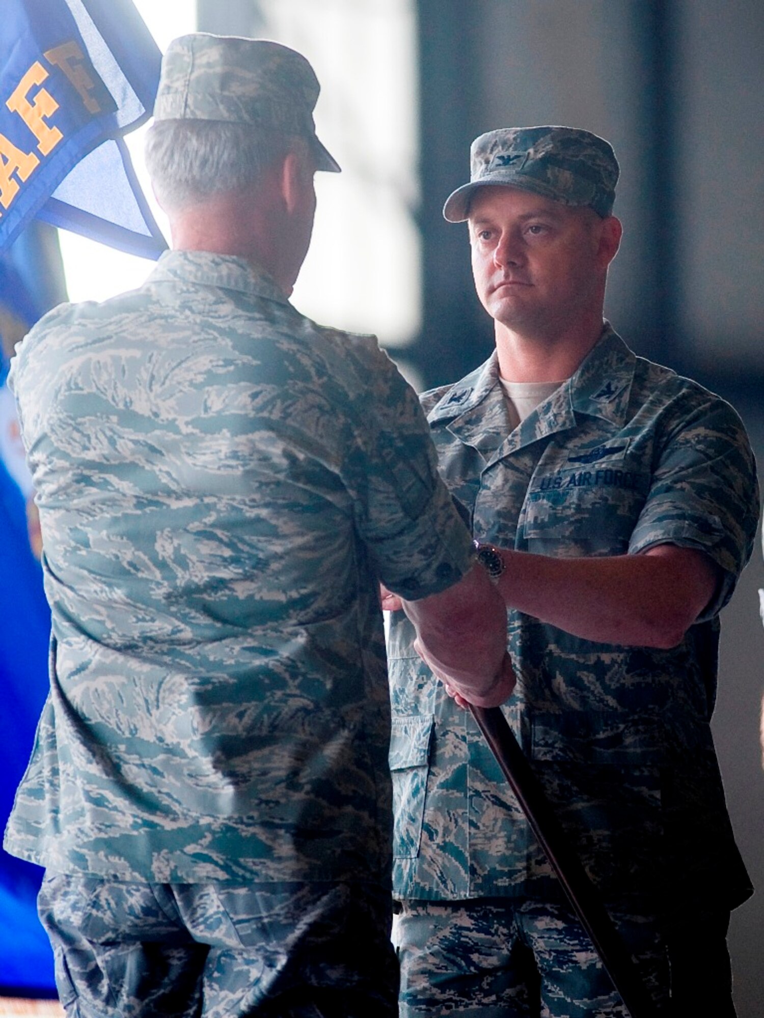 Col. Kevin J. Kilb, right, assumes command of the 62nd Airlift Wing from Maj. Gen. Winfield W. Scott III, left, 18th Air Force commander, June 26. (U.S. Air Force photo/Abner Guzman) 