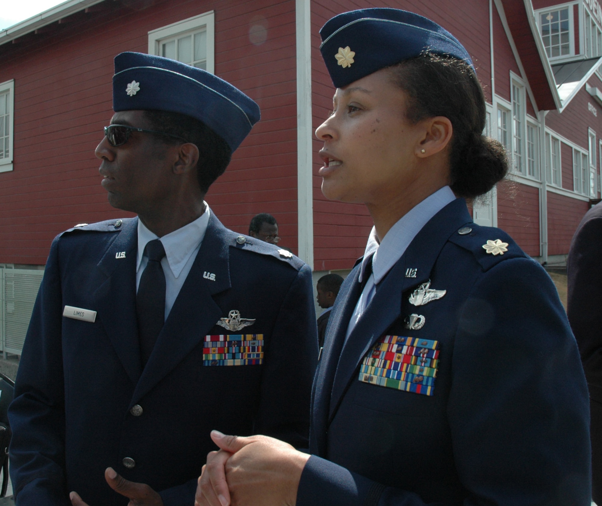Lt. Col. Ron Limes, left, a pilot with the 97th Airlift Squadron and Maj. Kimberly Scott, a pilot with the 728th Airlift Squadron, make sure everything goes smoothly during the Lt. Col. Michael Anderson memorial and Aerospace Scholarship Foundation presentation at the Museum of Flight in Seattle, June 26. Colonel Limes and Major Scott were critical factors in coordinating the event.