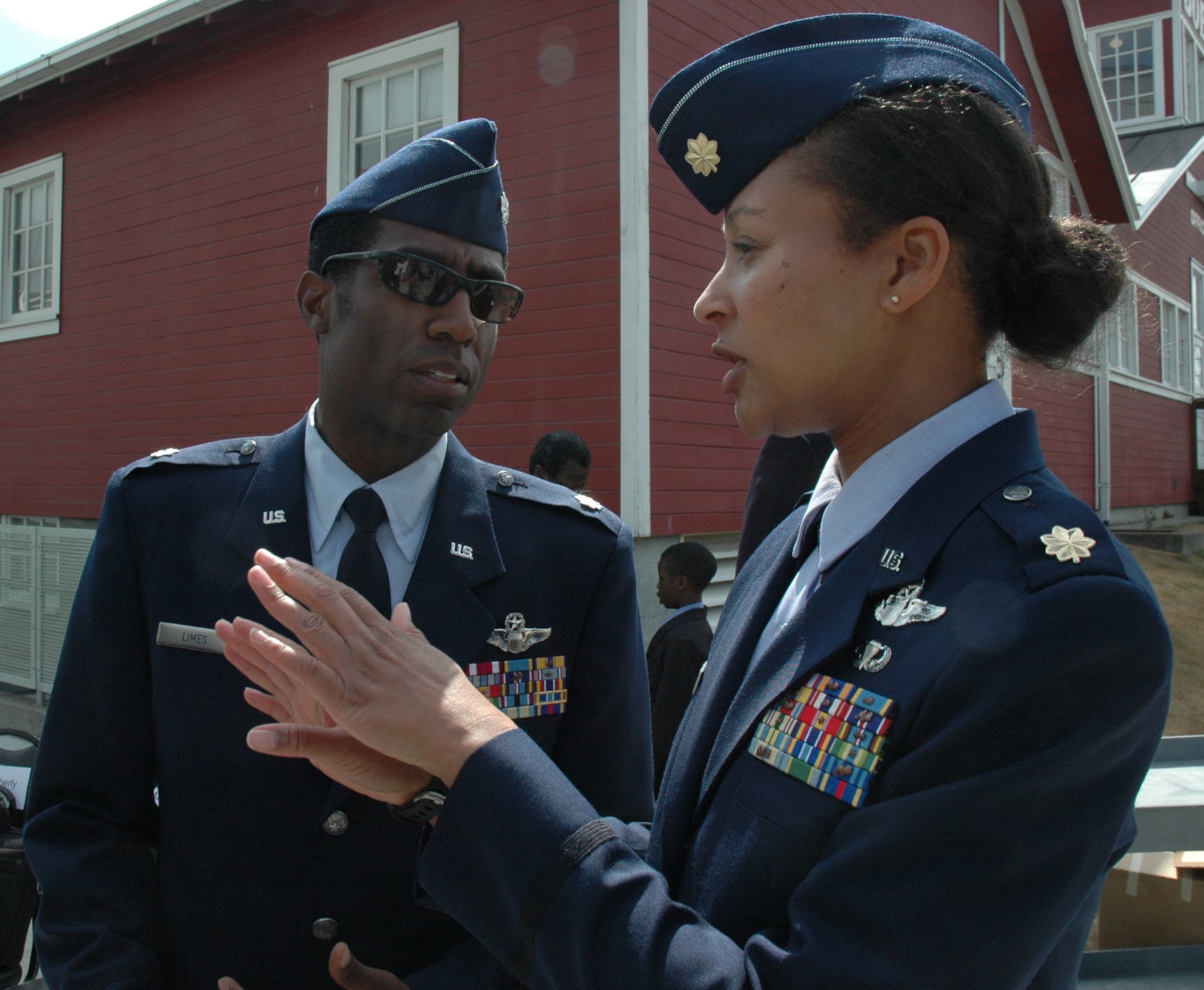 Lt. Col. Ron Limes, left, a pilot with the 97th Airlift Squadron and Maj. Kimberly Scott, a pilot with the 728th Airlift Squadron, make sure everything goes smoothly during the Lt. Col. Michael Anderson memorial and Aerospace Scholarship Foundation presentation at the Museum of Flight in Seattle, June 26. Colonel Limes and Major Scott were critical factors in coordinating the event.